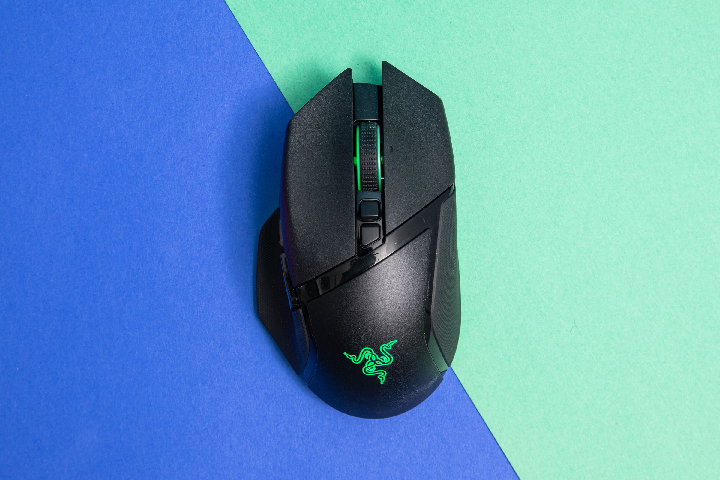 Top-down shot of Razer Basilisk V3 Pro on a blue and green background