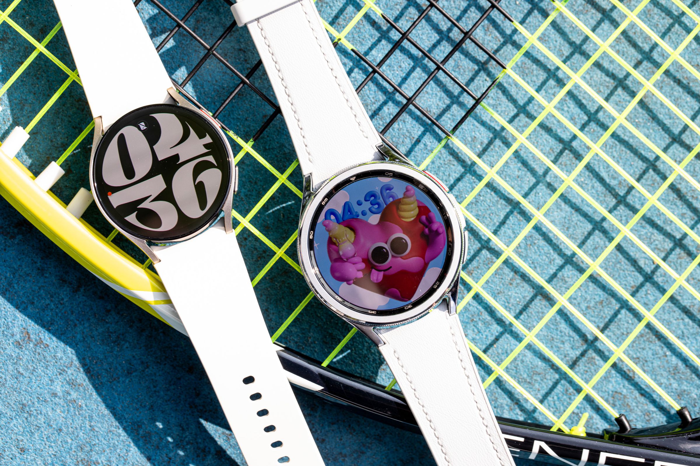 Samsung Galaxy Watch 6 and Watch 6 Classic on top of a tennis racket