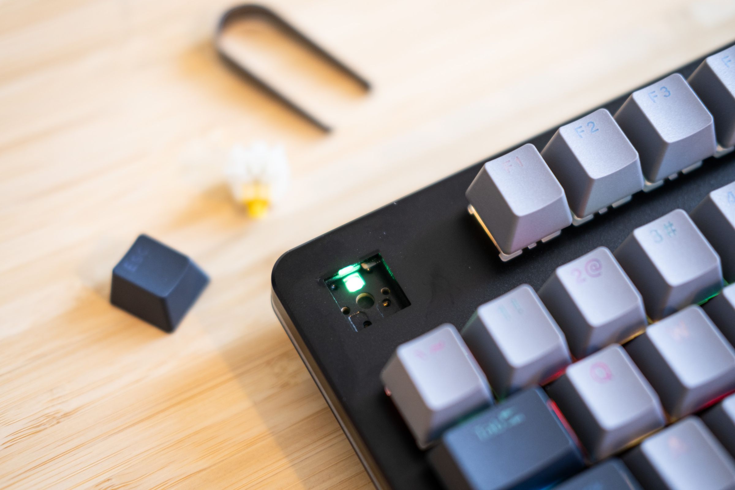 Close up of keyboard with keycap and switch removed.