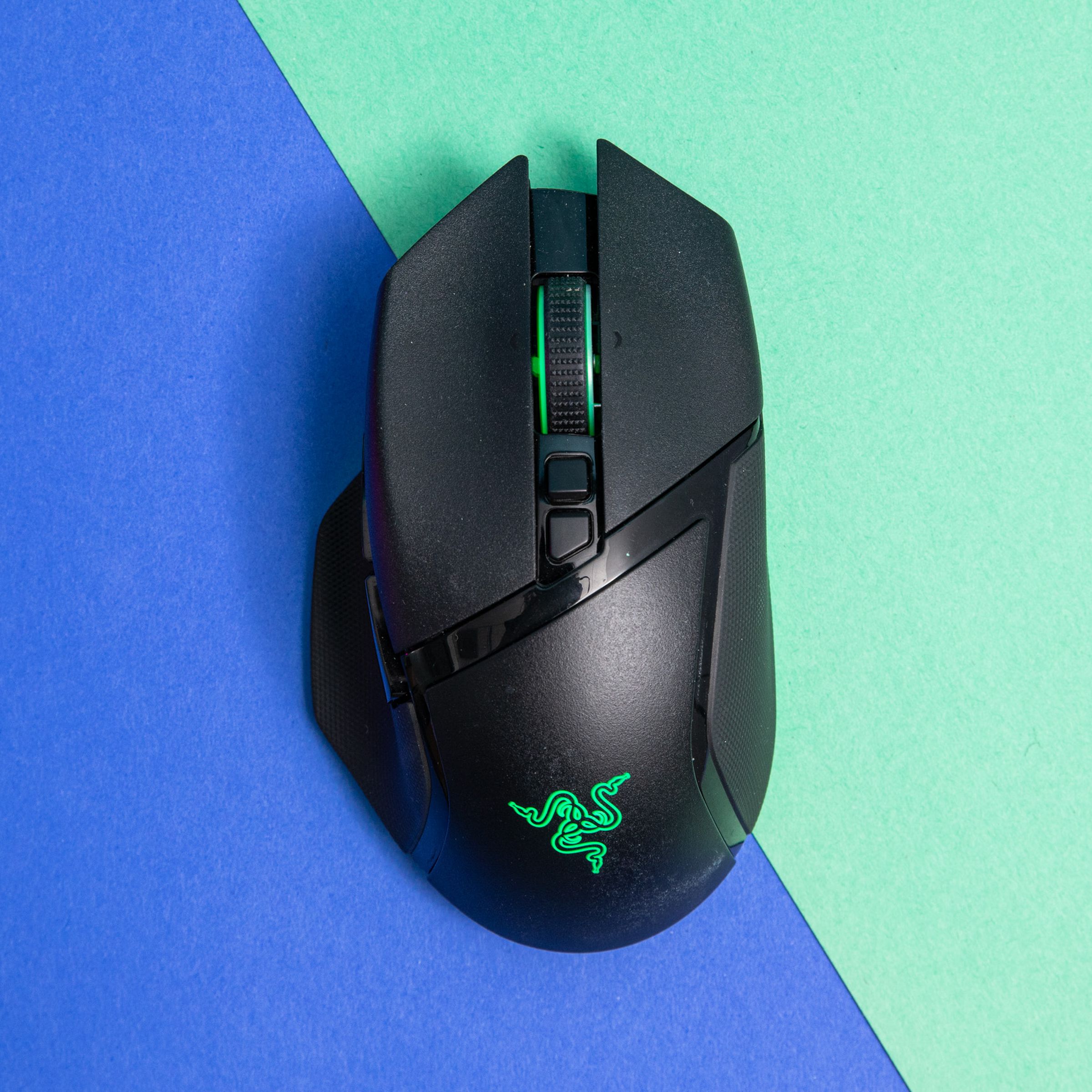 Top-down shot of Razer Basilisk V3 Pro on a blue and green background