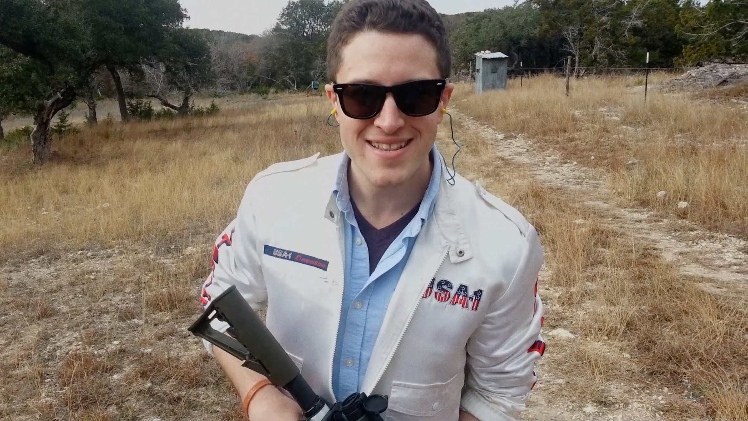 Cody Wilson, testing a 3D-printed rifle in The New Radical.