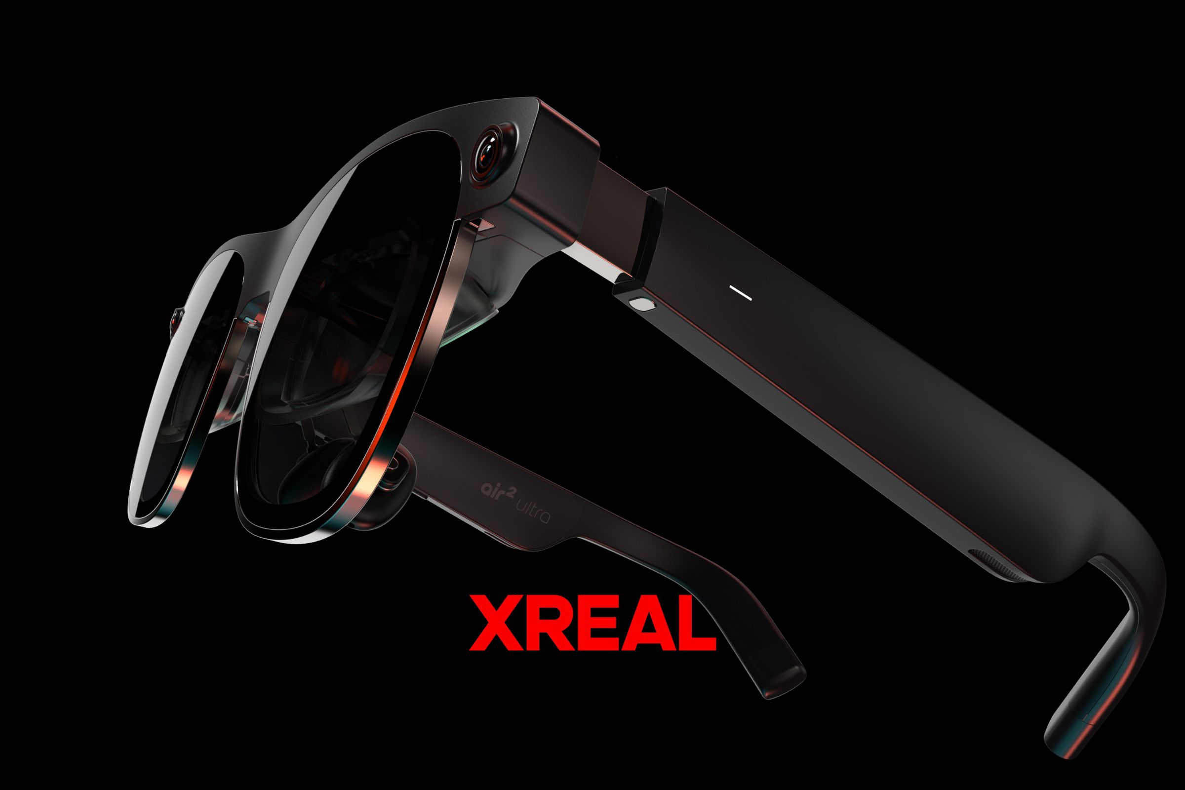 A pair of sunglasses-like AR glasses with the label “Xreal.”