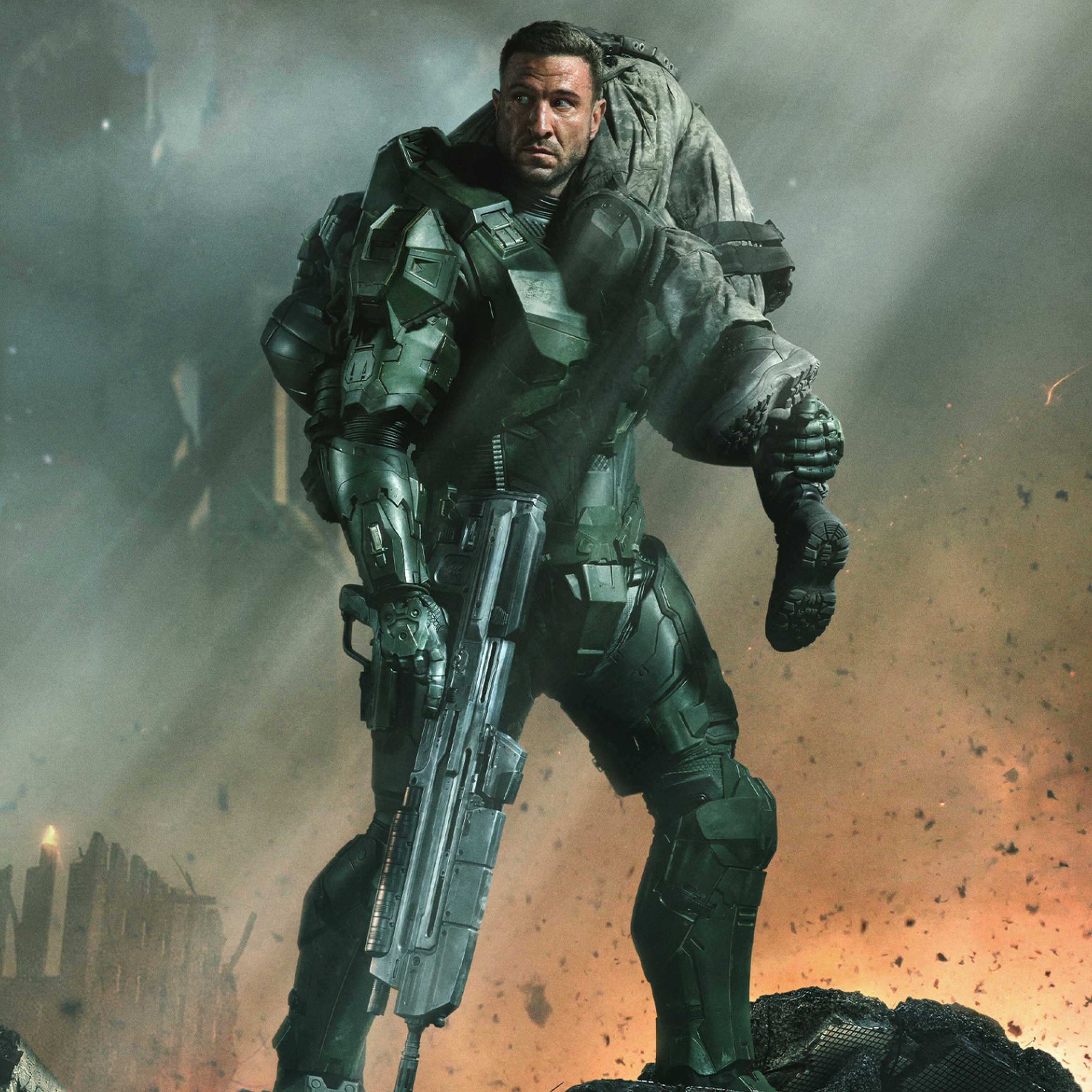 Promotional image from Halo season 2 featuring Master Chief against a war ravaged city carrying an injured civilian.