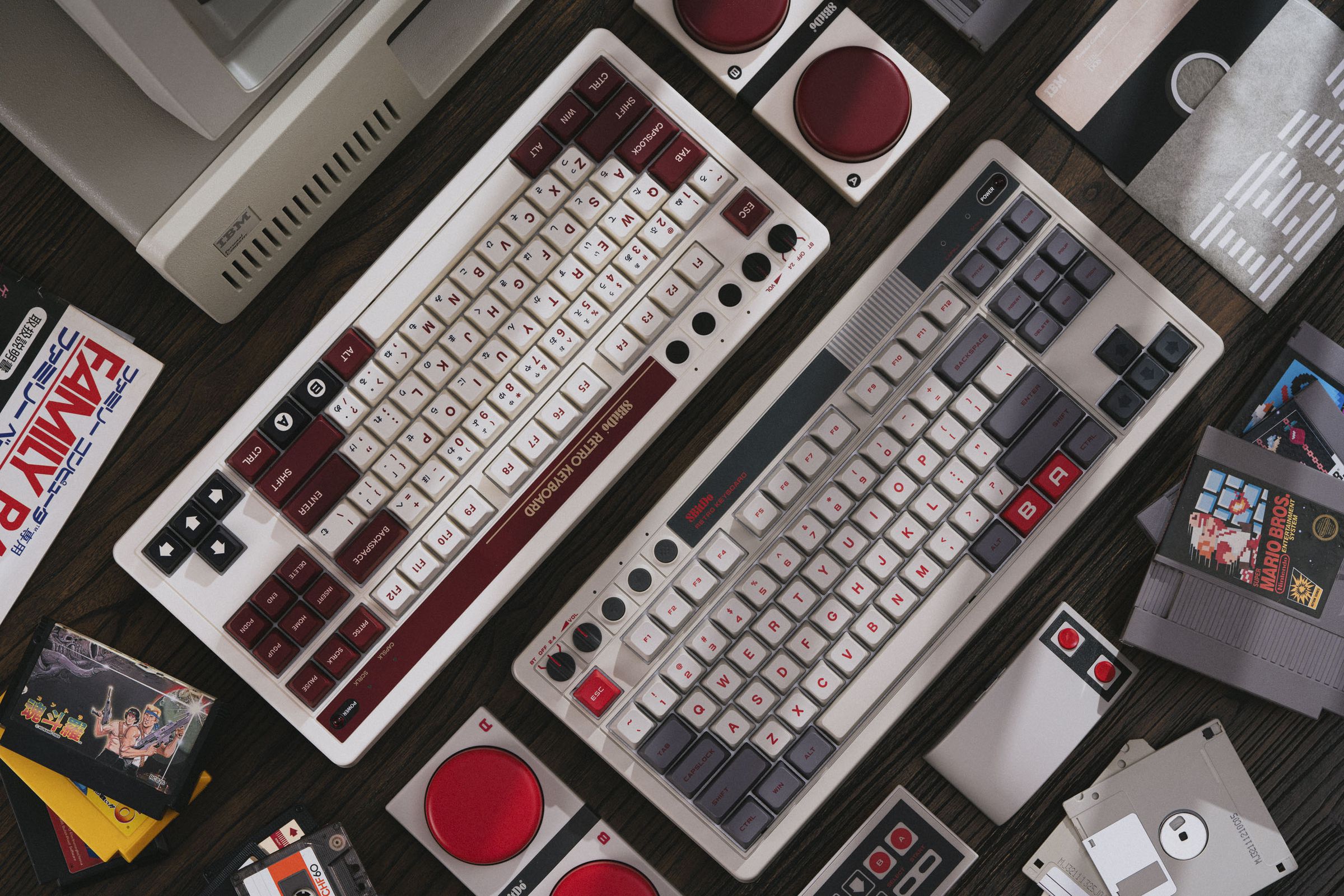 Two keyboards in a sea of retro tech and Nintendo paraphernalia.