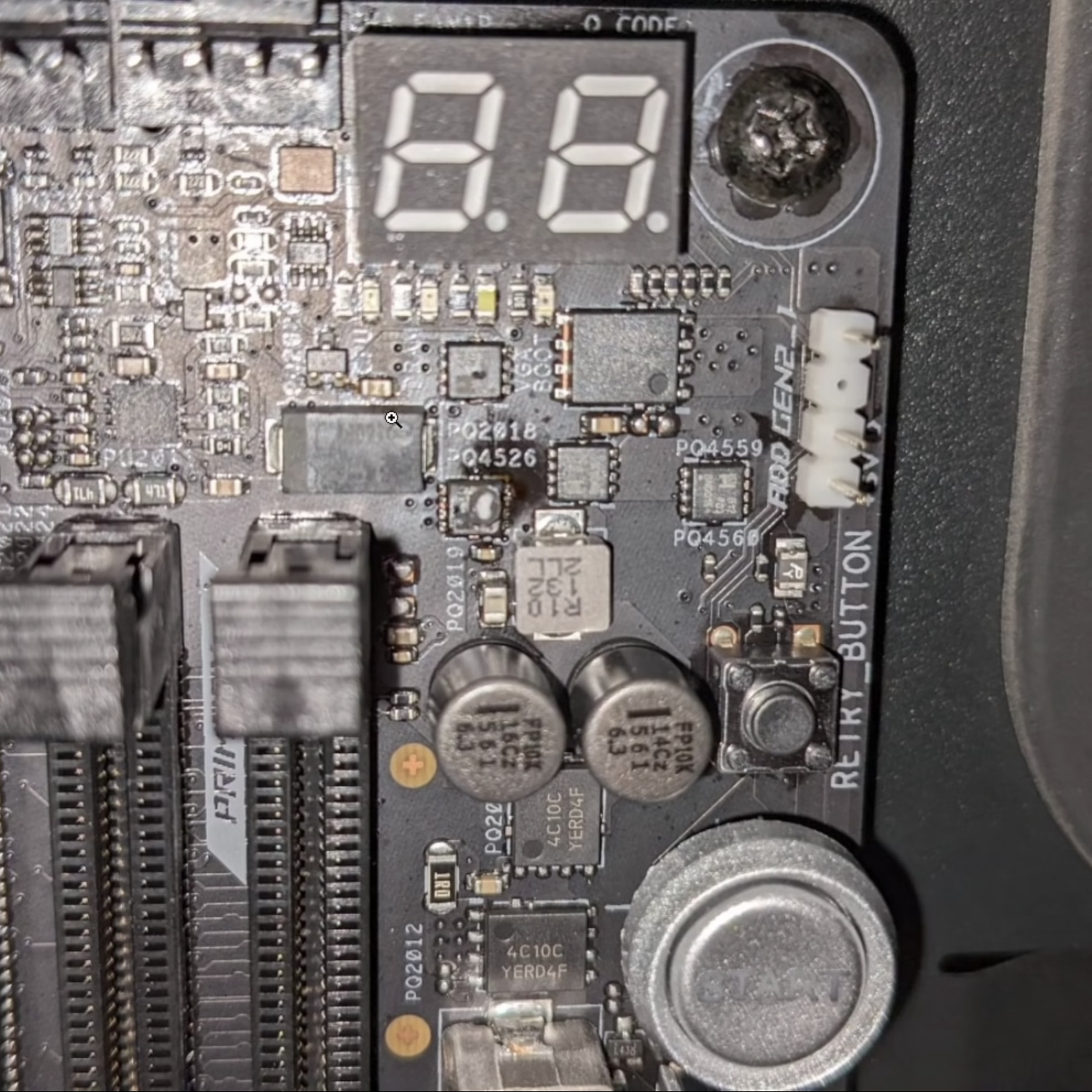 An Asus Z690 Hero motherboard with burnt up MOSFETs.