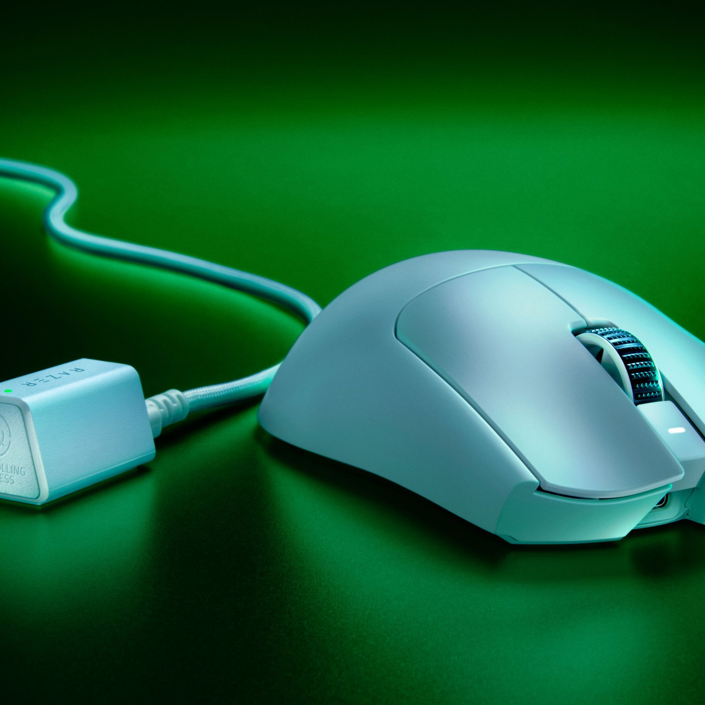 A white mouse with a typical sculpted rounded Razer design, somewhat evoking a hooded snake