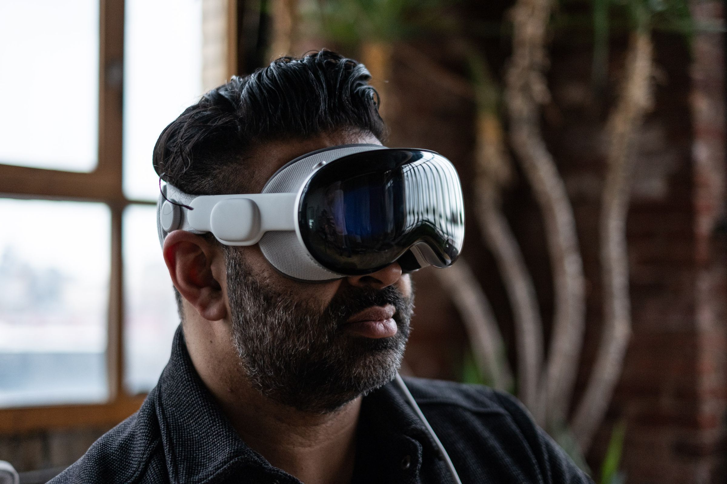 A person wearing the Apple Vision Pro headset.