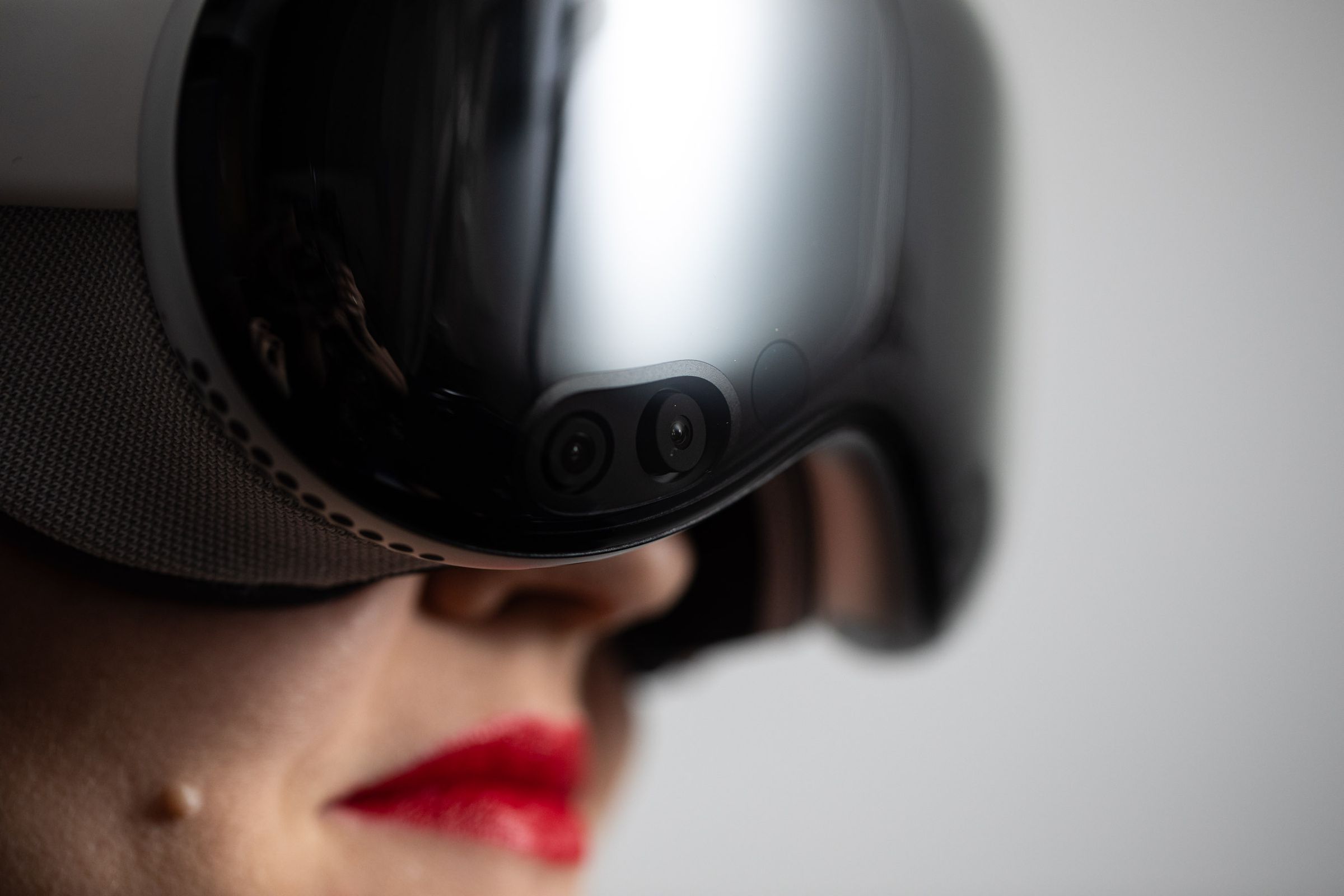 A close up of a woman wearing the Vision Pro