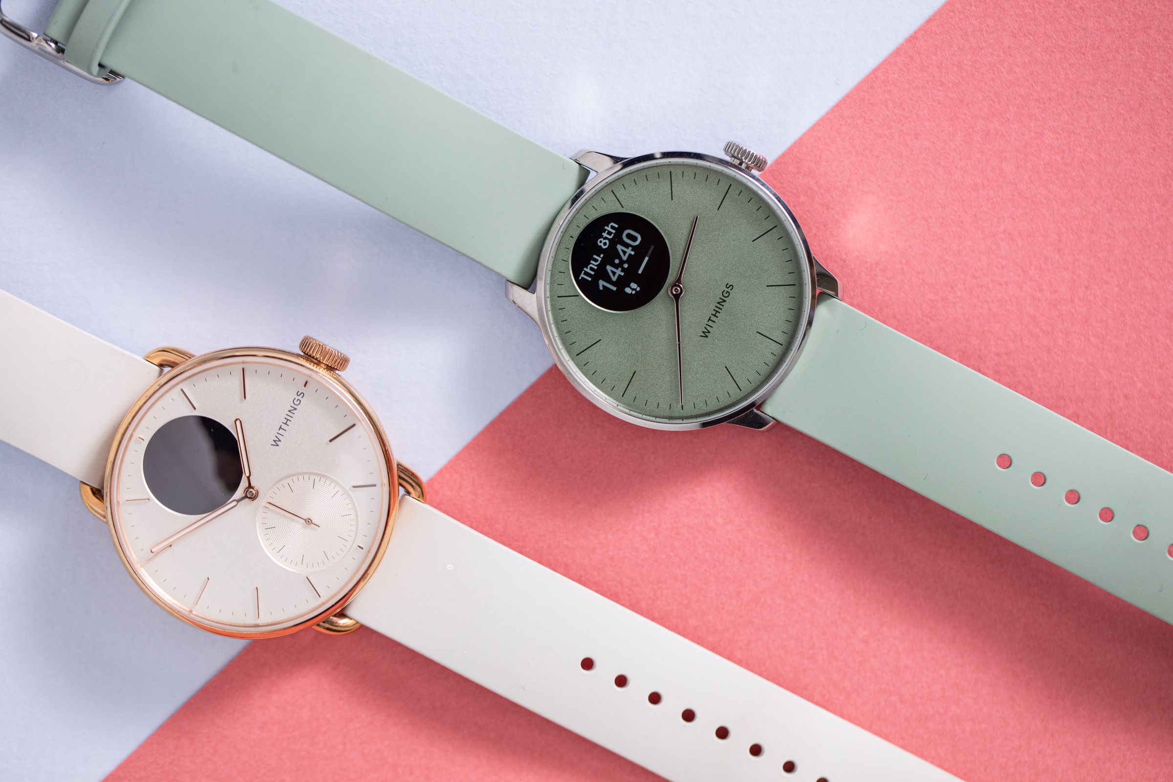 The Withings ScanWatch 2 and ScanWatch Light side by side on a colorful background.