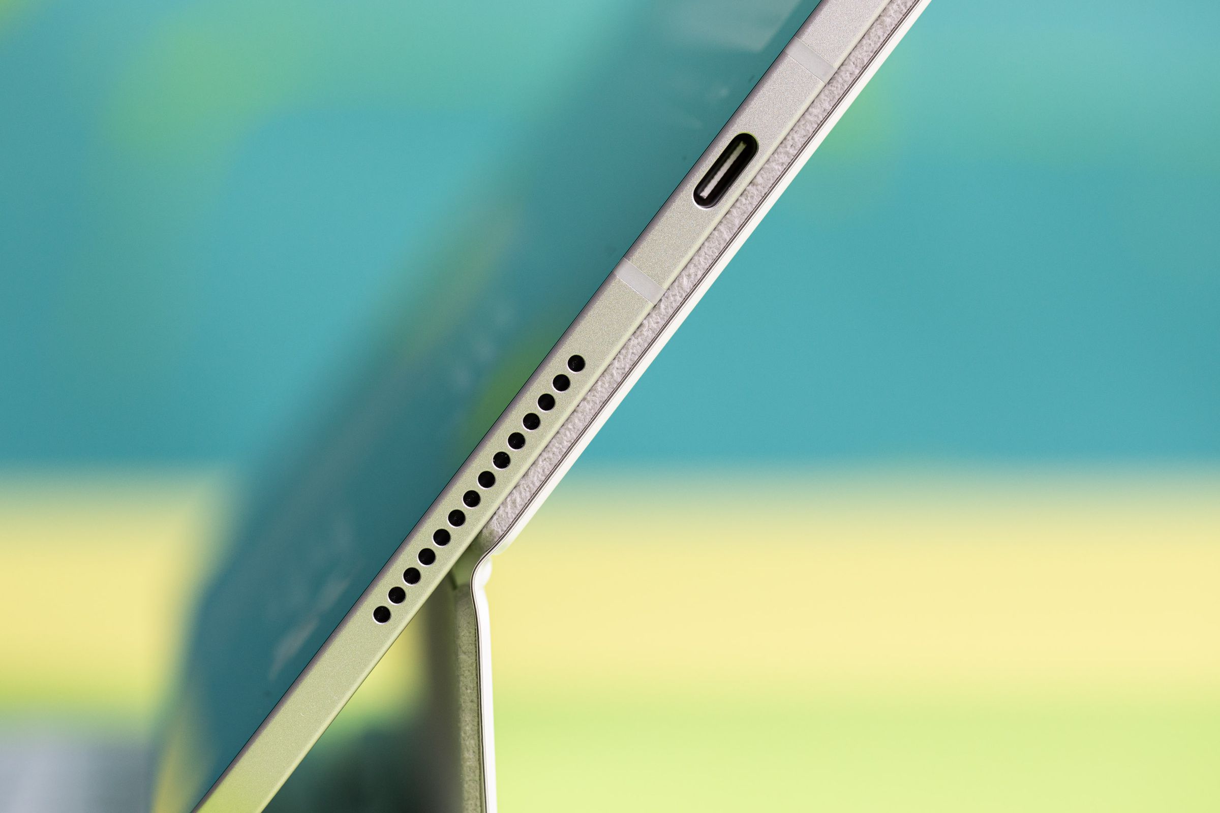 A photo of the edge of an iPad Pro, showing the speaker and USB-C port.