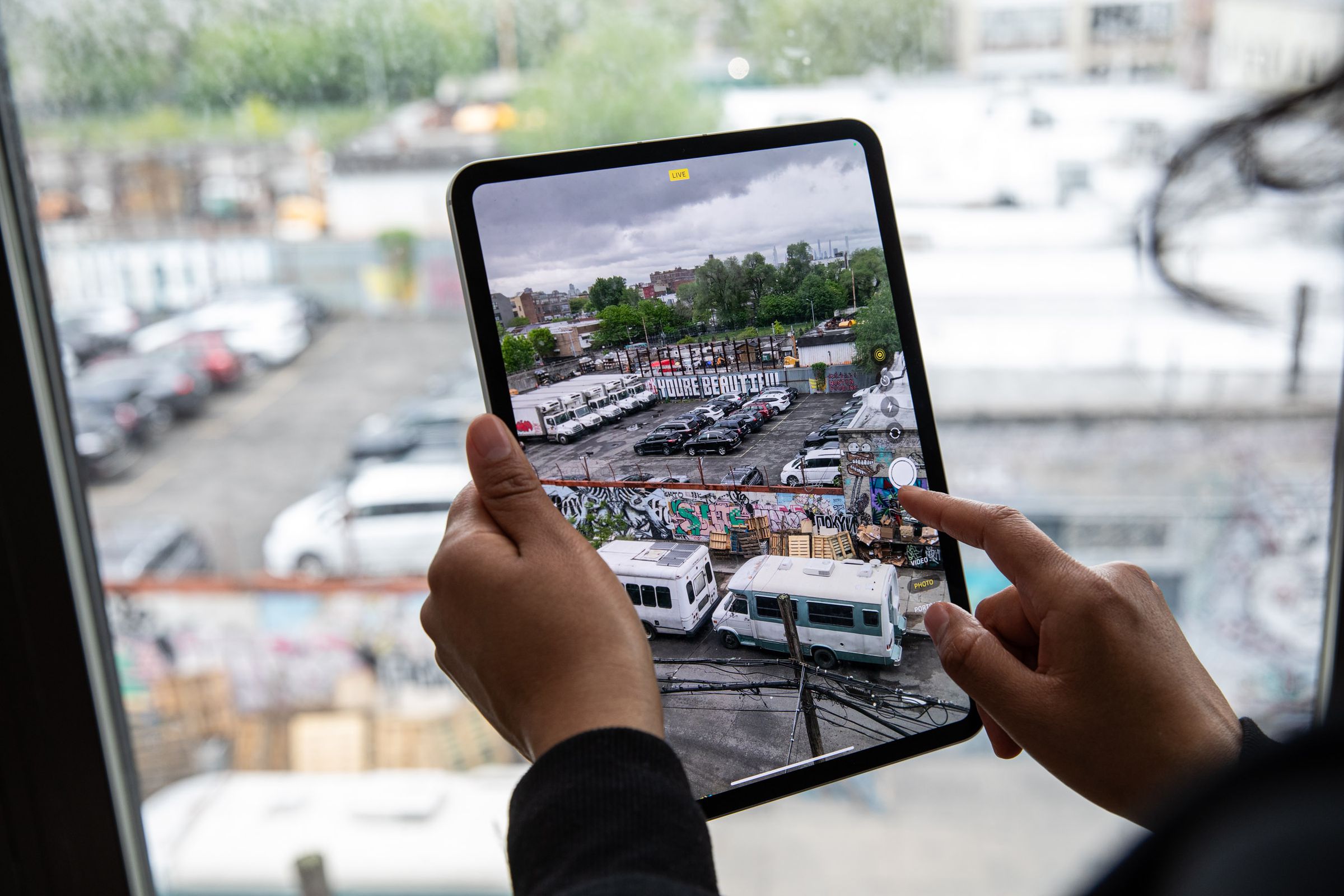 A photo of the iPad Pro, showing a live view of a parking lot.