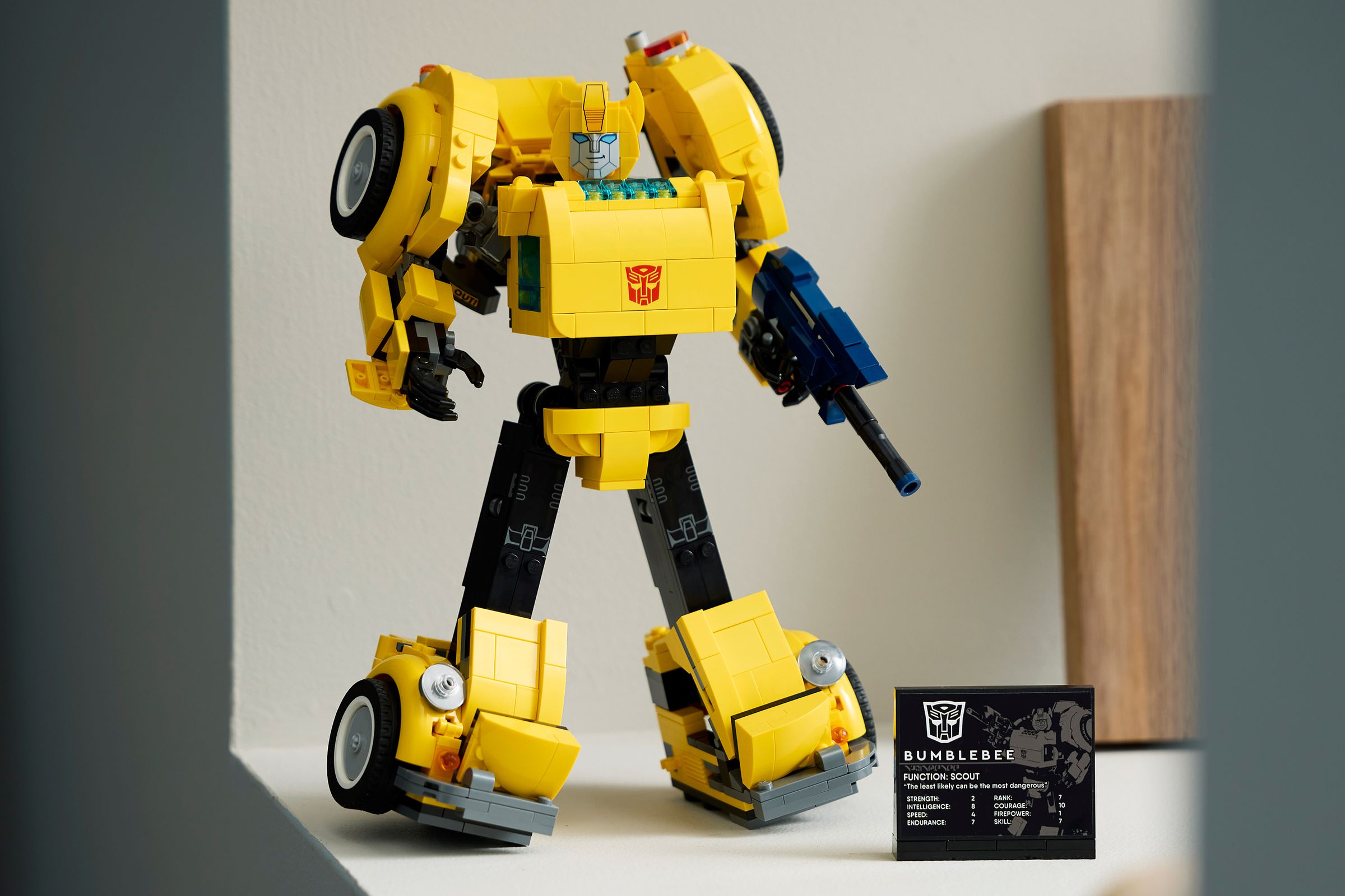 Lego’s Bumblebee model standing in robot mode next to a display plaque.