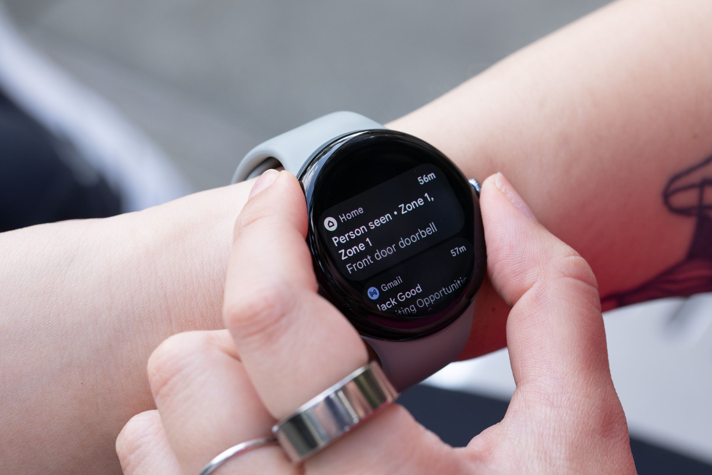 Person looking at Nest Doorbell notification on Pixel Watch 3