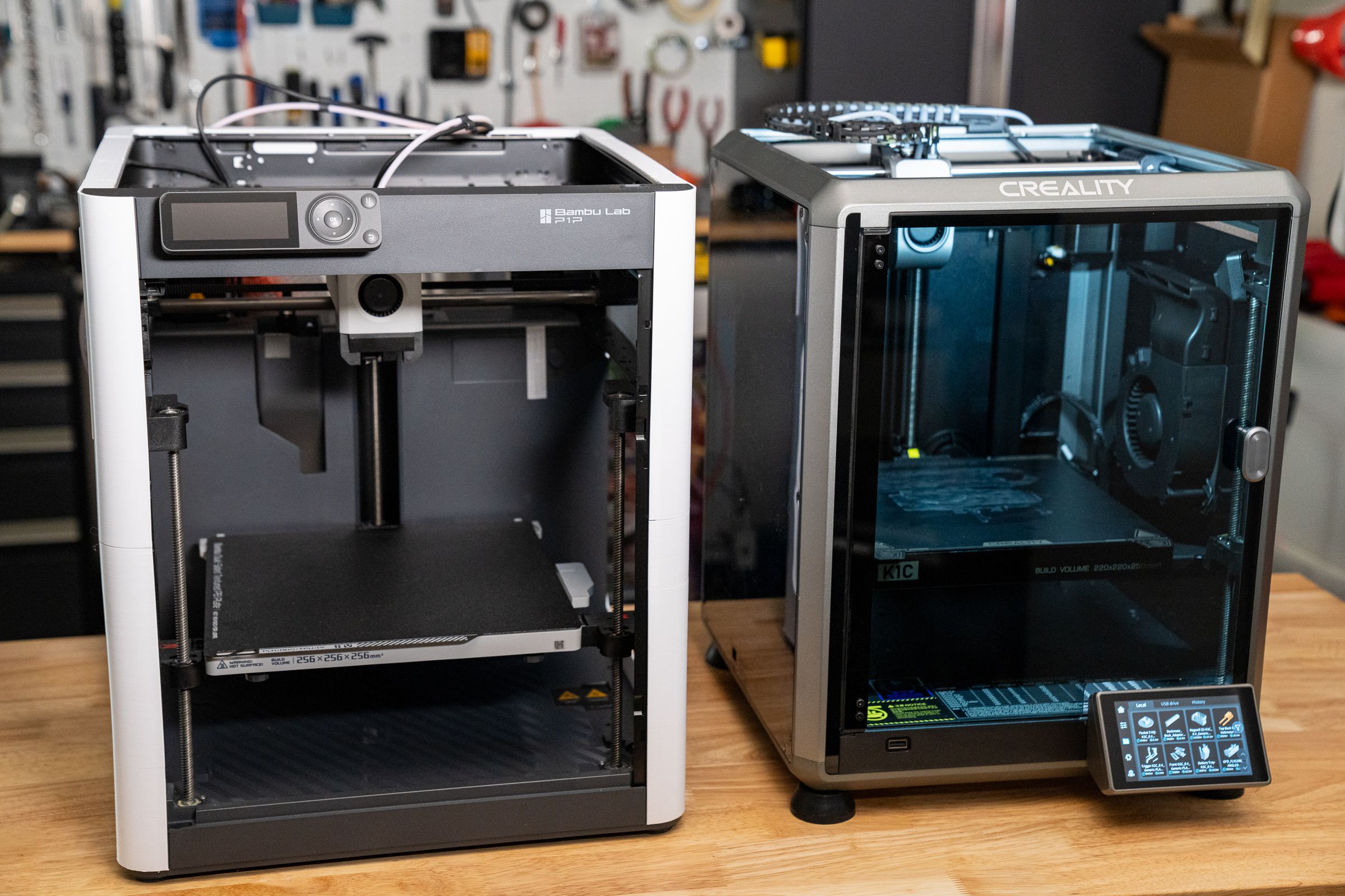 Left: Bambu P1P with 3D printed panels. Right: Creality K1C with stock enclosure