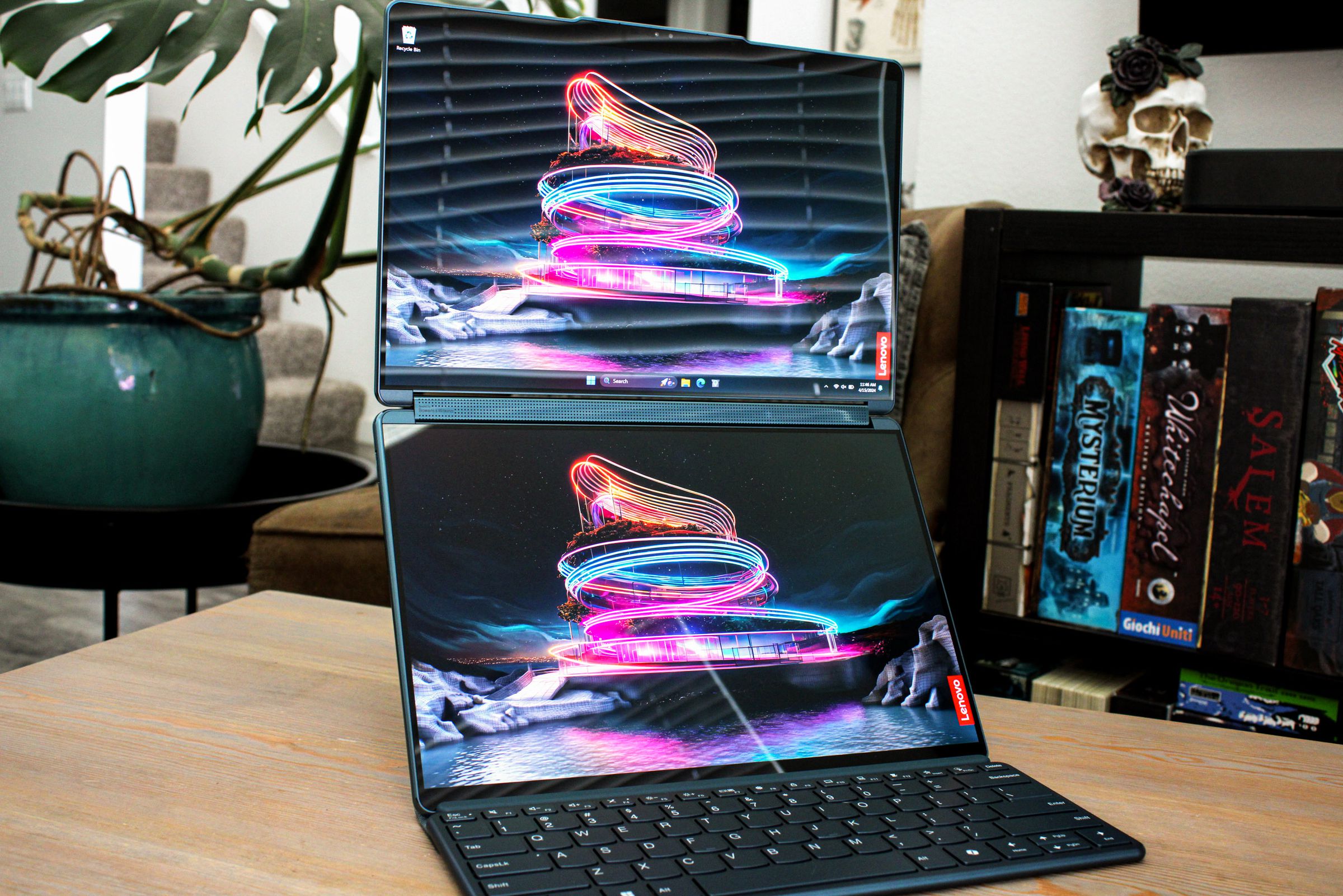 A dual screen laptop open and powered on.