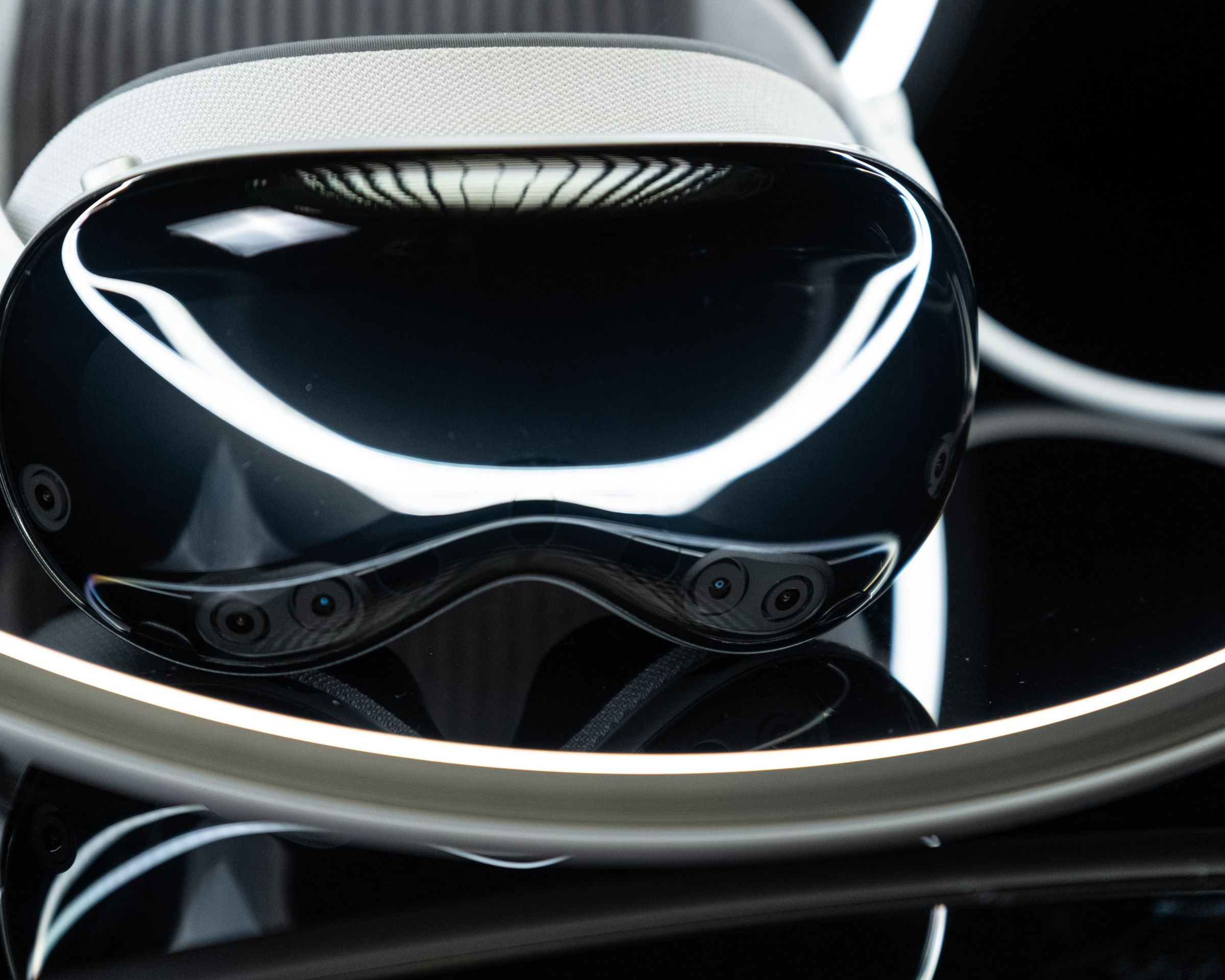 The Vision Pro headset, photographed so that you can see the cameras on the front.