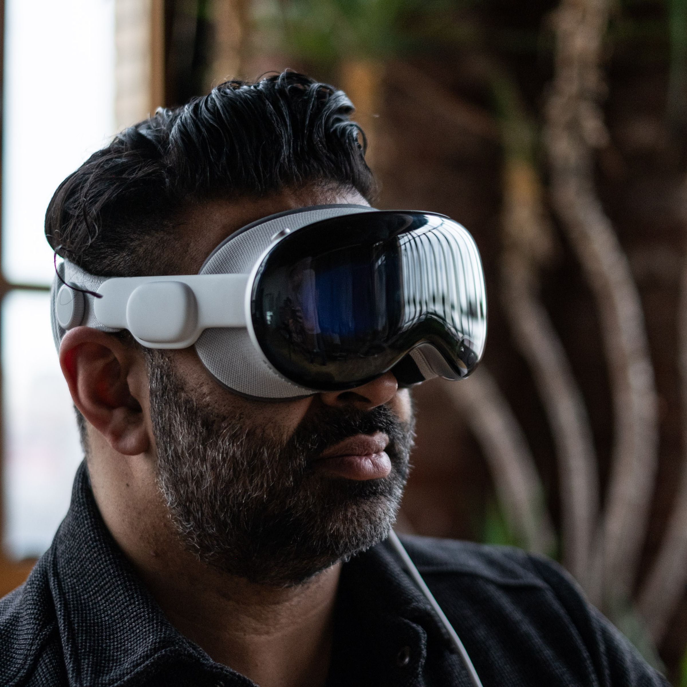 A person wearing the Apple Vision Pro headset.