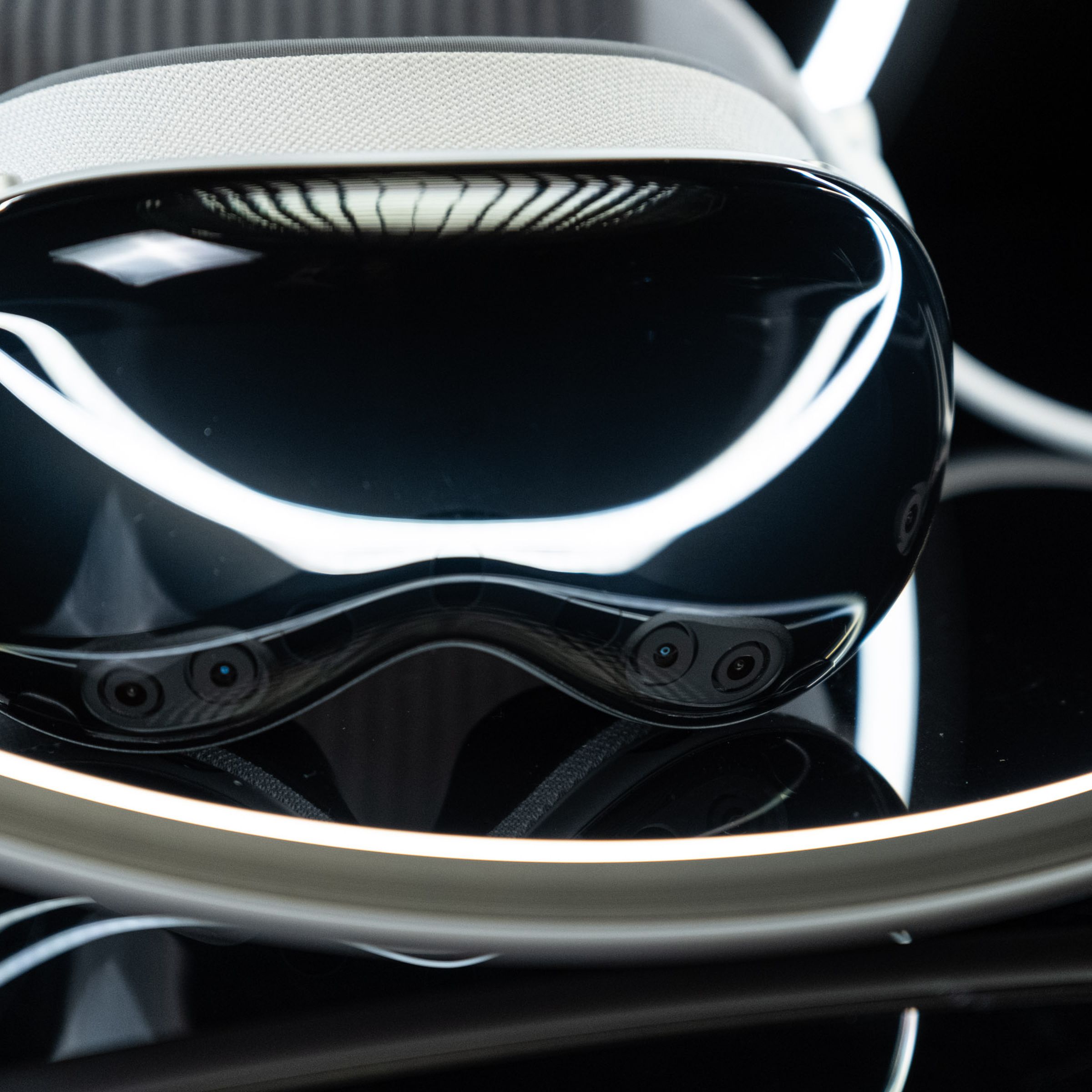 The Vision Pro headset, photographed so that you can see the cameras on the front.