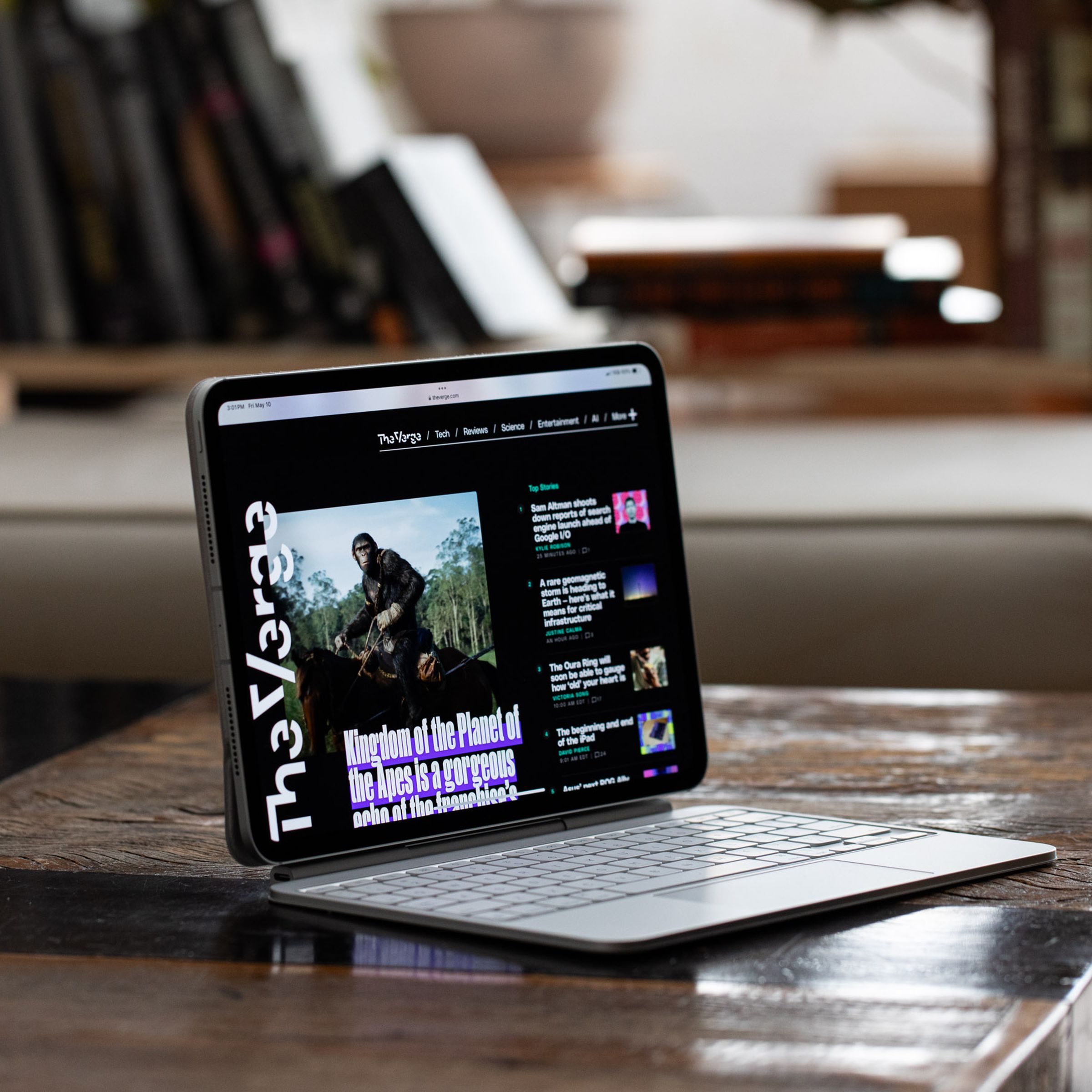 An Apple iPad Pro with a keyboard attached on a desk .