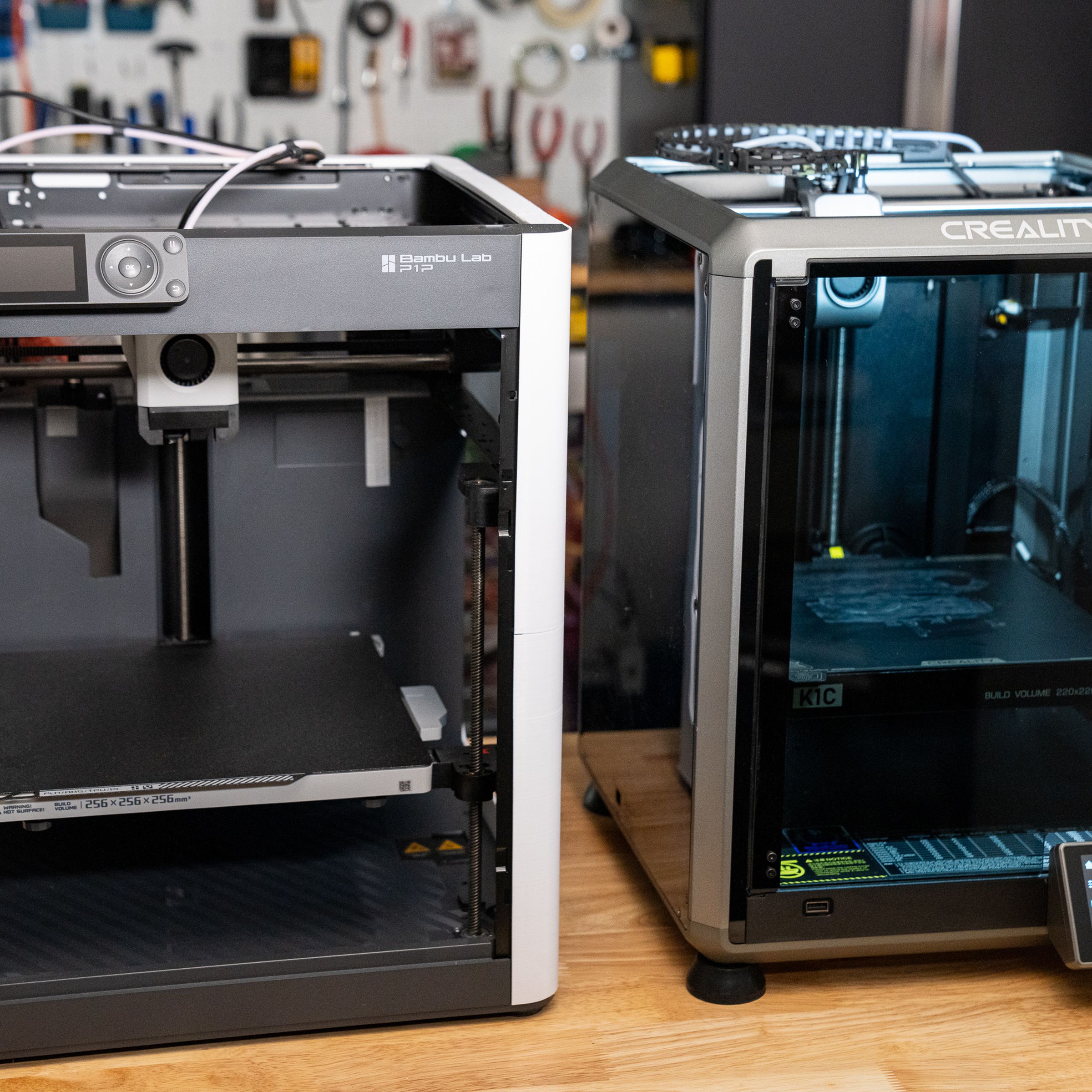 Left: Bambu P1P with 3D printed panels. Right: Creality K1C with stock enclosure