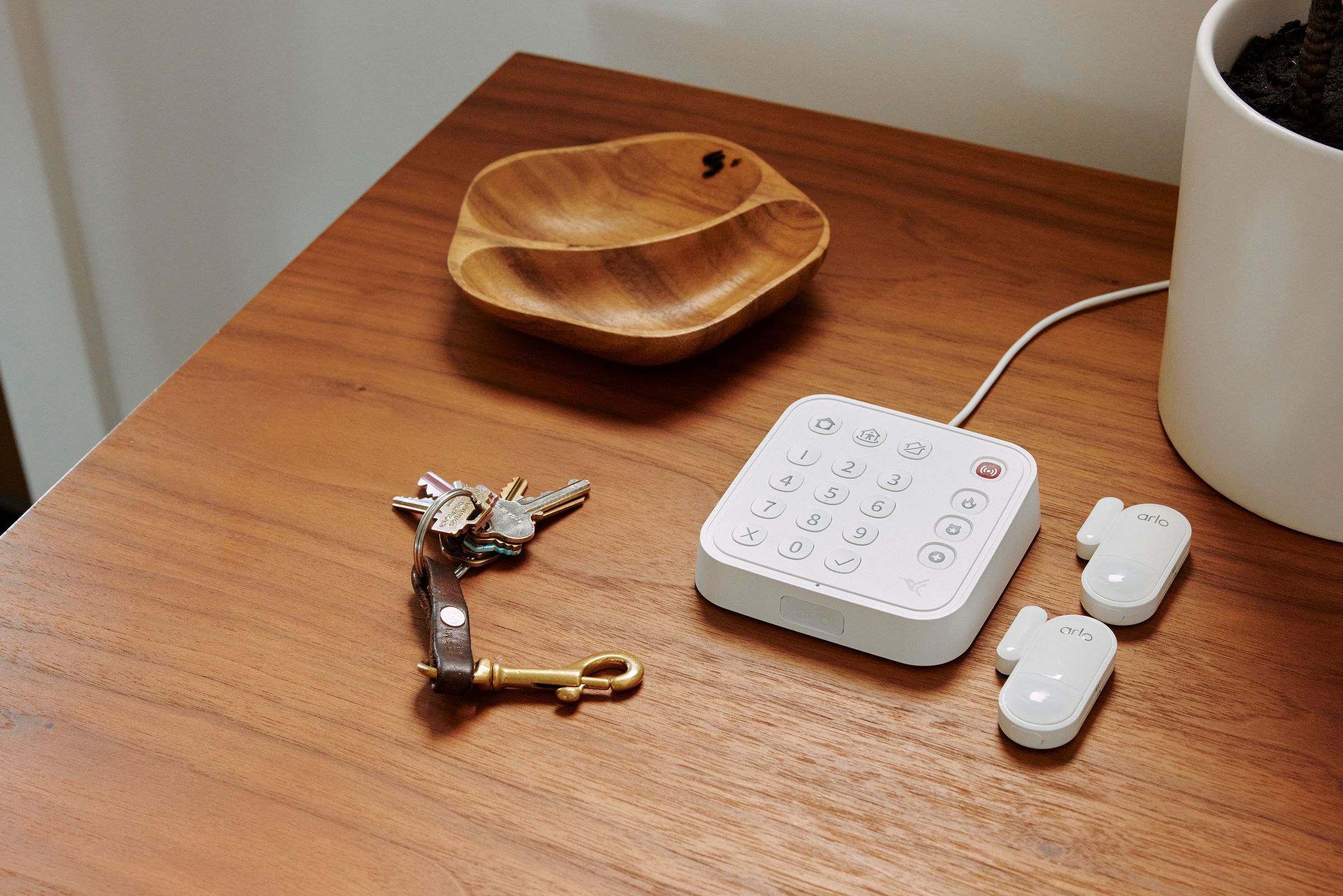 Arlo’s Home Security Keypad Sensor Hub, and two of the all-in-one multi-sensors.