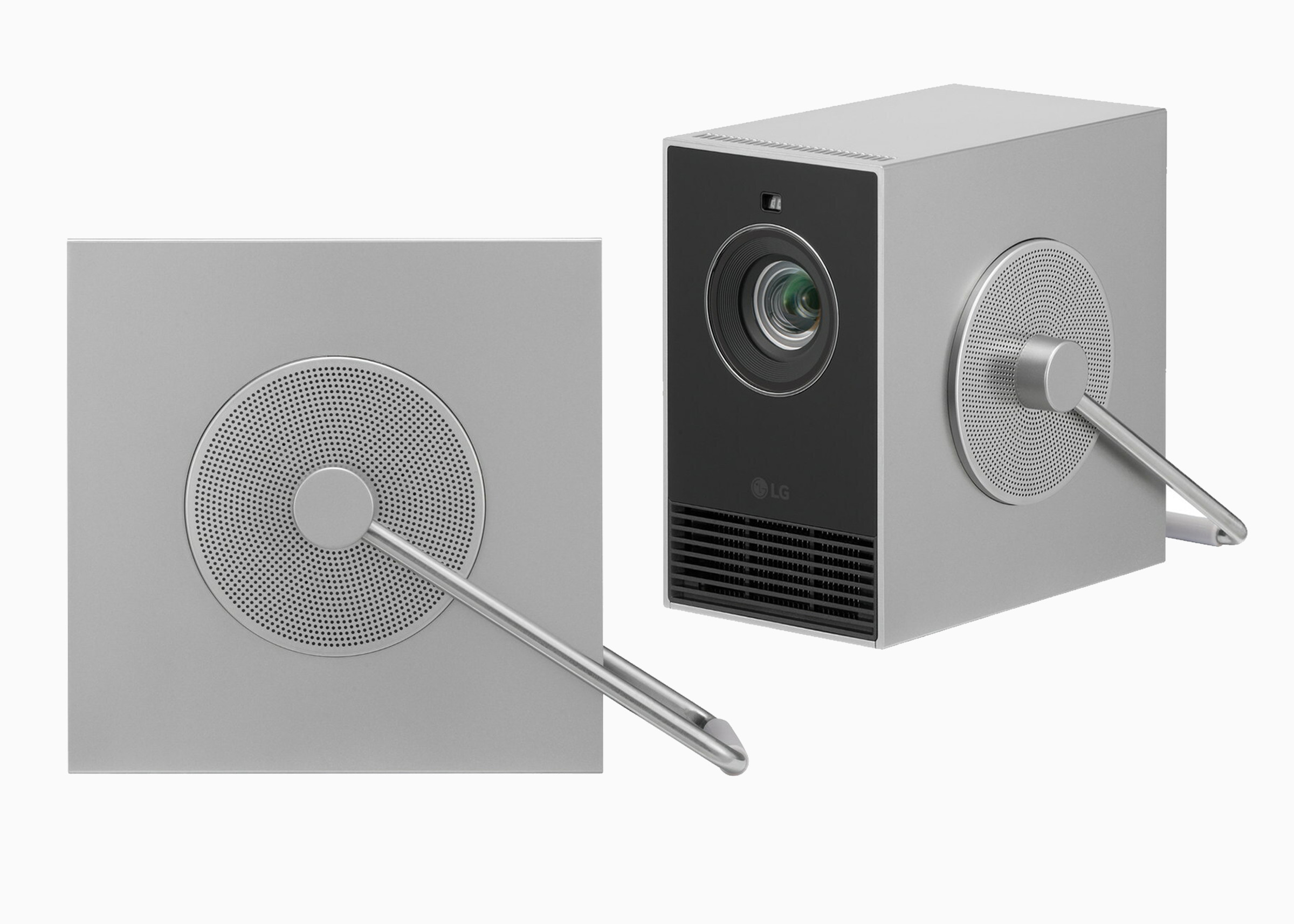 A picture of the Qube in profile and three-quarter view. The profile image highlights the circular surround where the handle attaches to its side. The surround is filled with tiny holes arranged like those on a speaker grille.