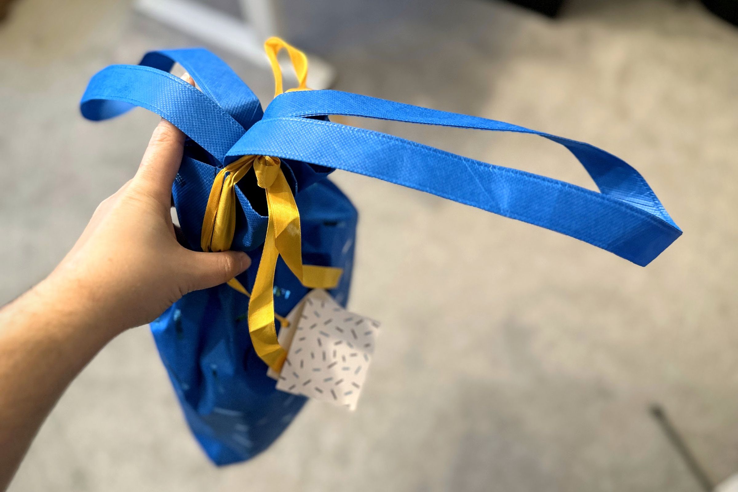 This blue medium-size Amazon bag has handles just like a reusable grocery store bag.