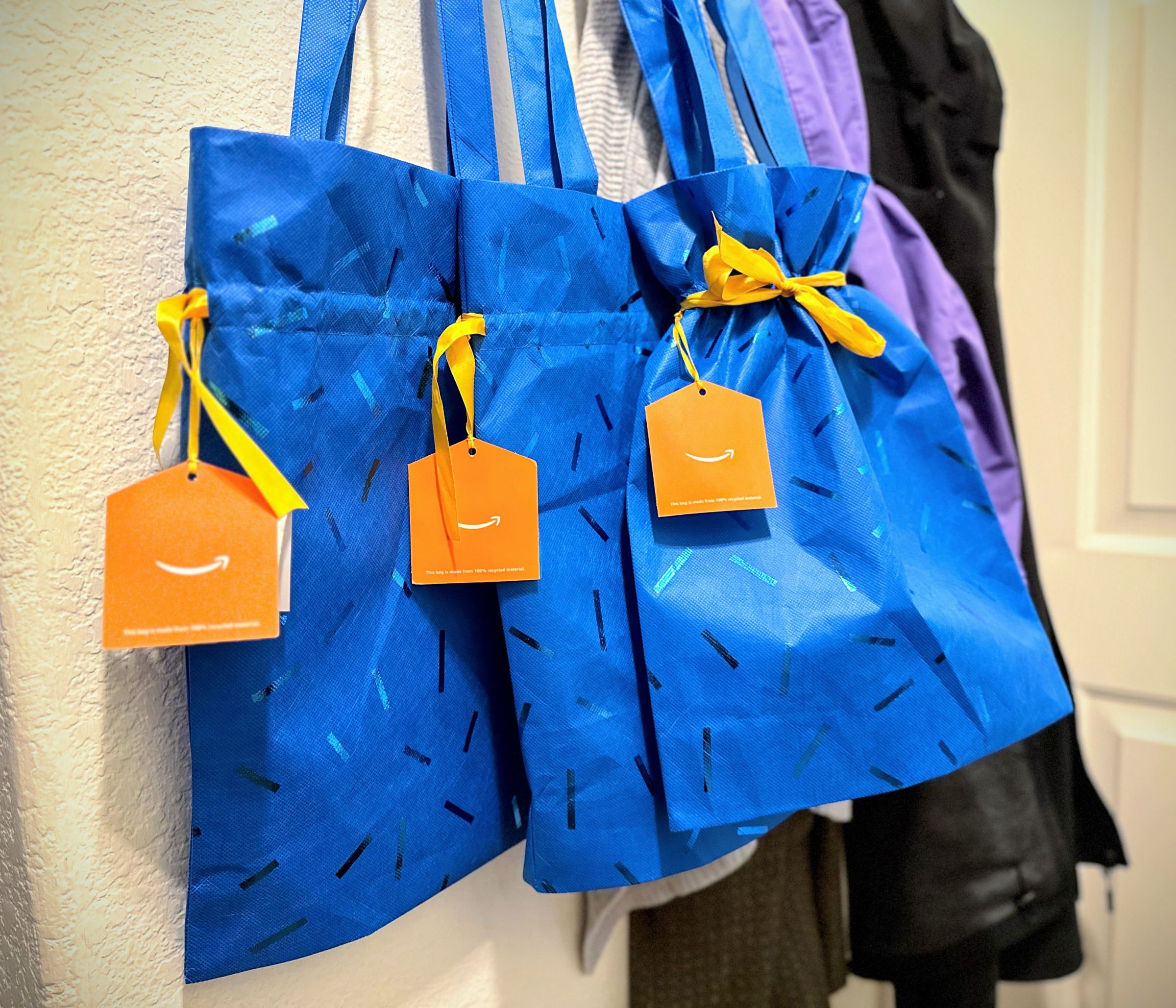 Three gift bags, with handles.