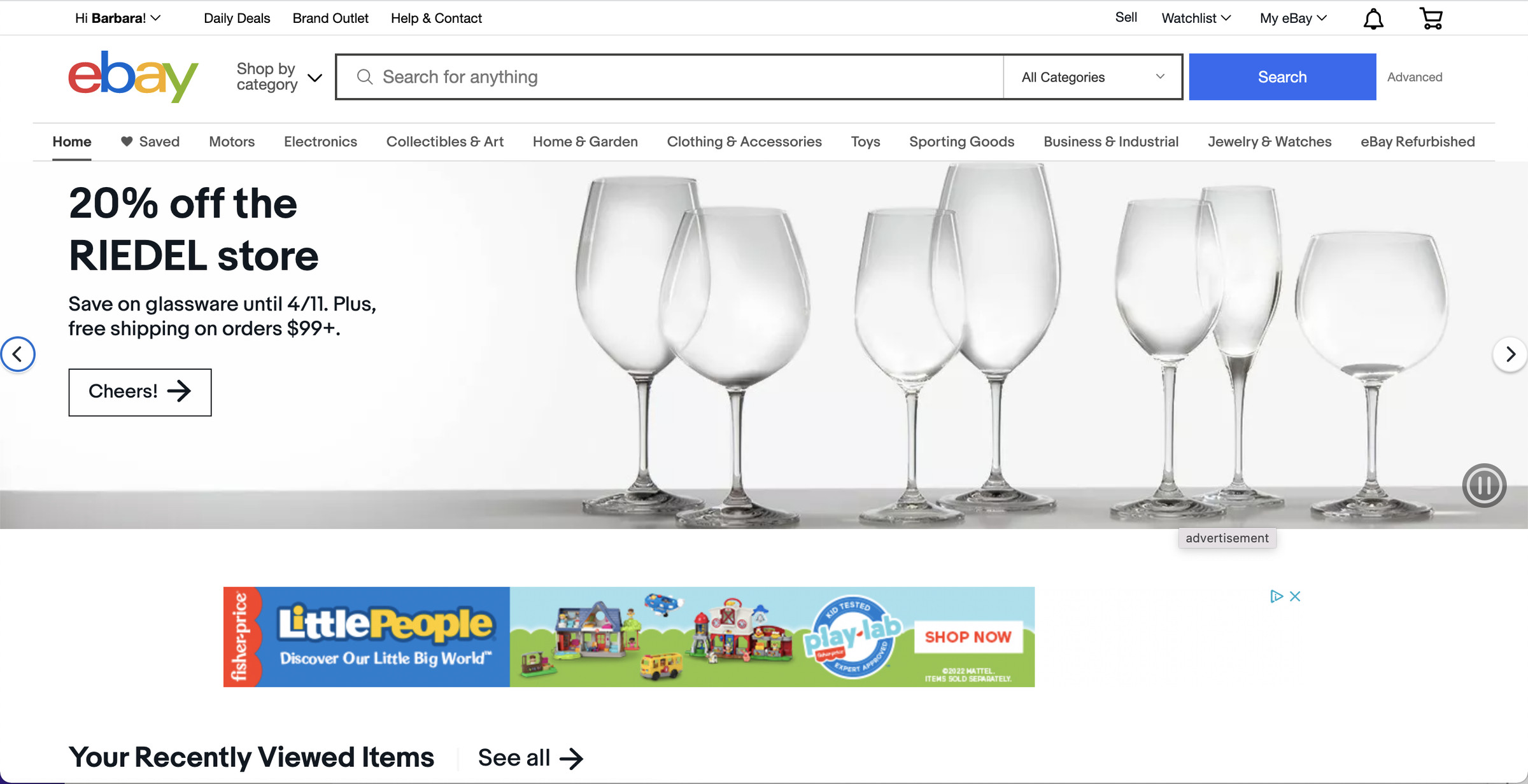 The eBay front page showing some wine glasses with the caption “20% off the Riedel Store” and an ad for “LittlePeople” below it.