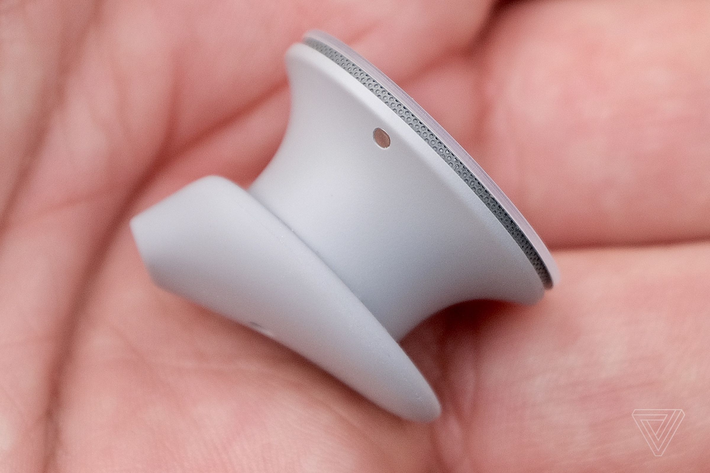 A close-up photo of the exterior Surface Earbuds design.