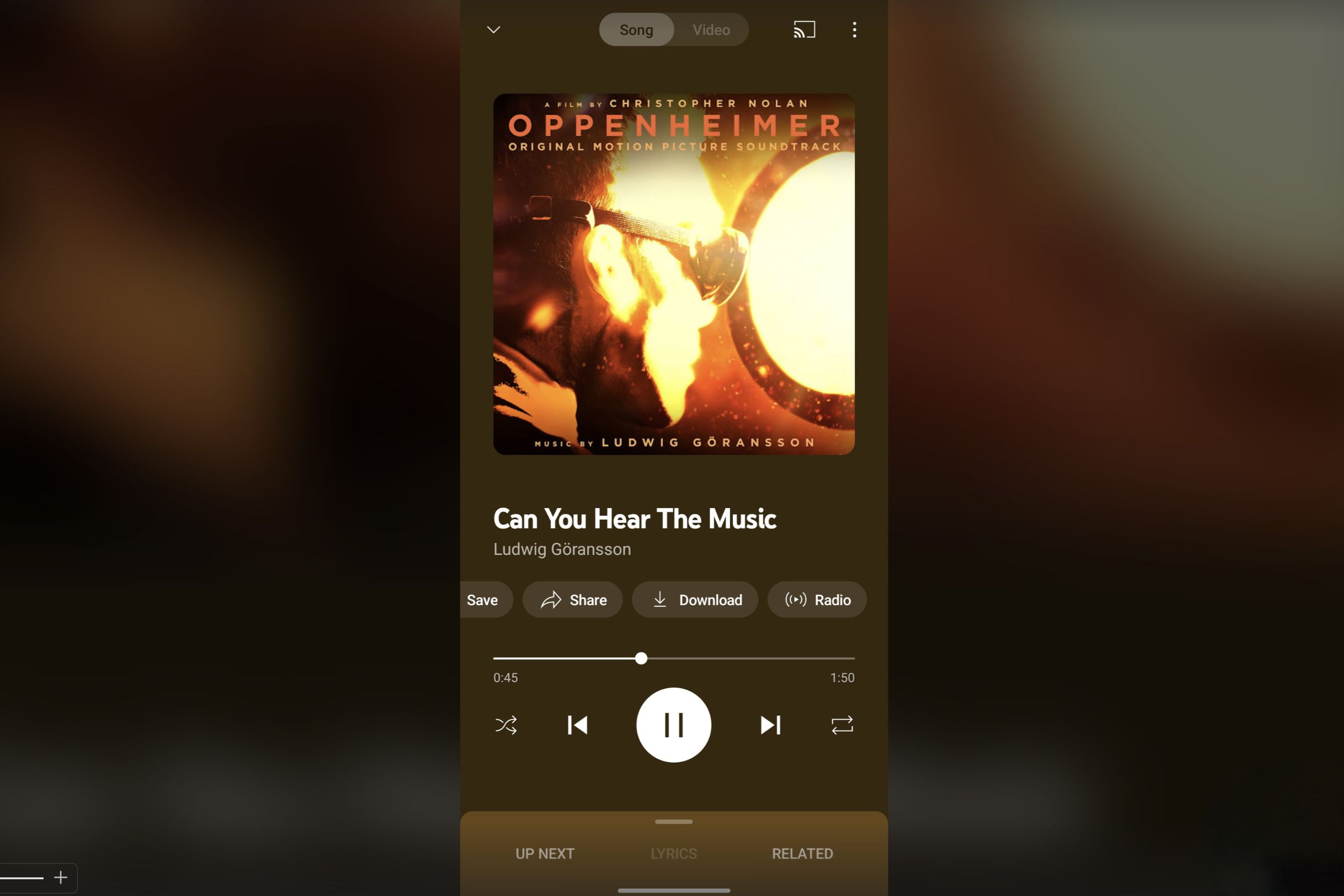 screenshot of youtube music now playing, playing oppenhiemer soundtrack titled “can you hear the music,” and there’s new buttons above the progress bar.
