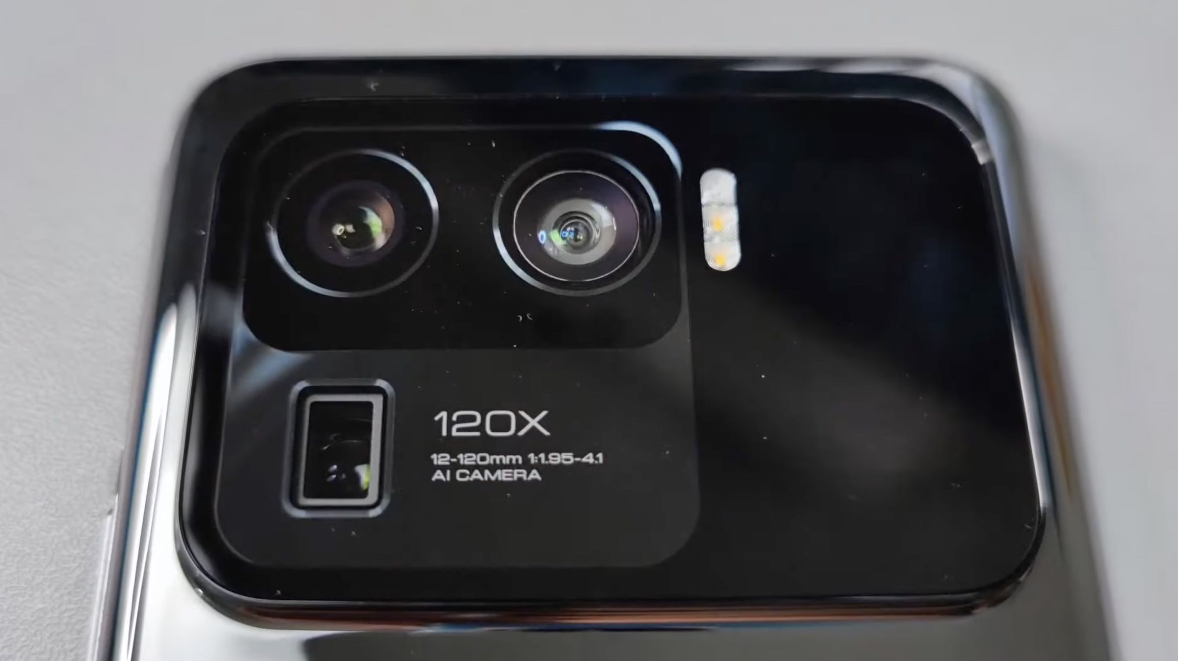 The device shows three cameras, including a periscope-style lens with 120x hybrid zoom.