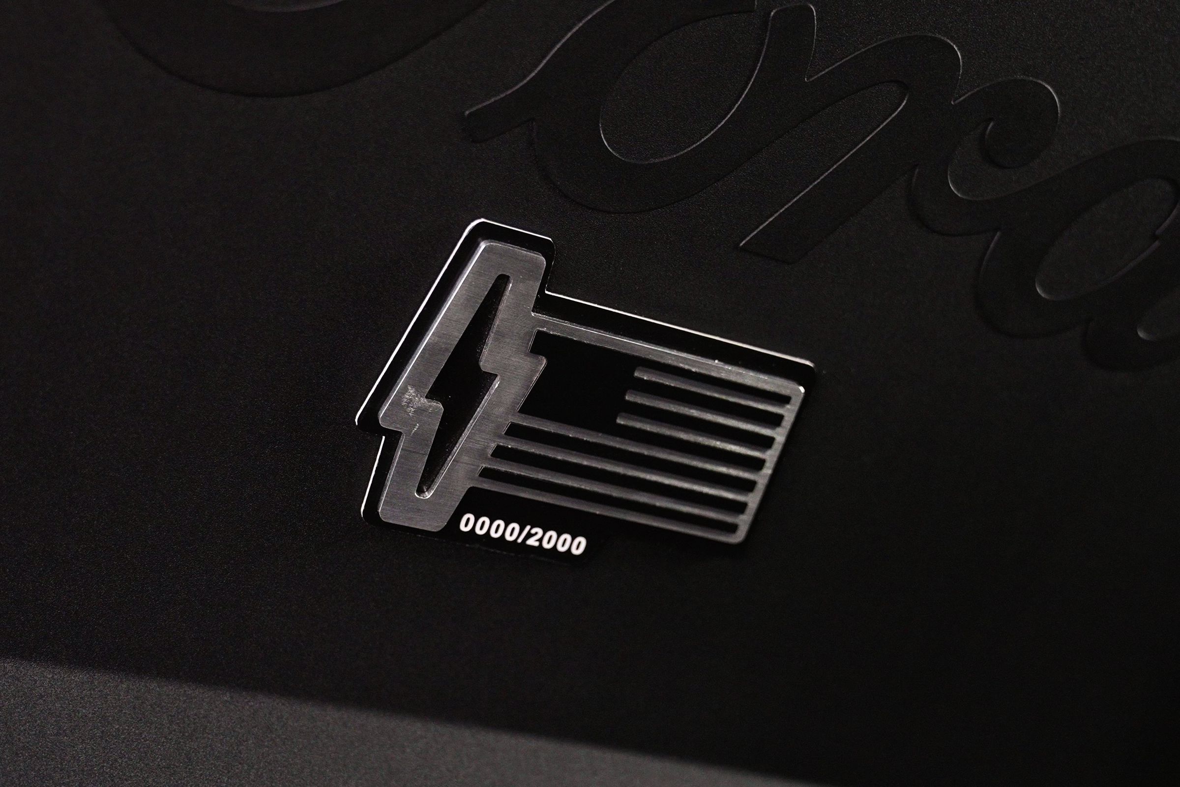 The numbered limited-edition badge inside the frunk of the F-150 Lightning Platinum Black.