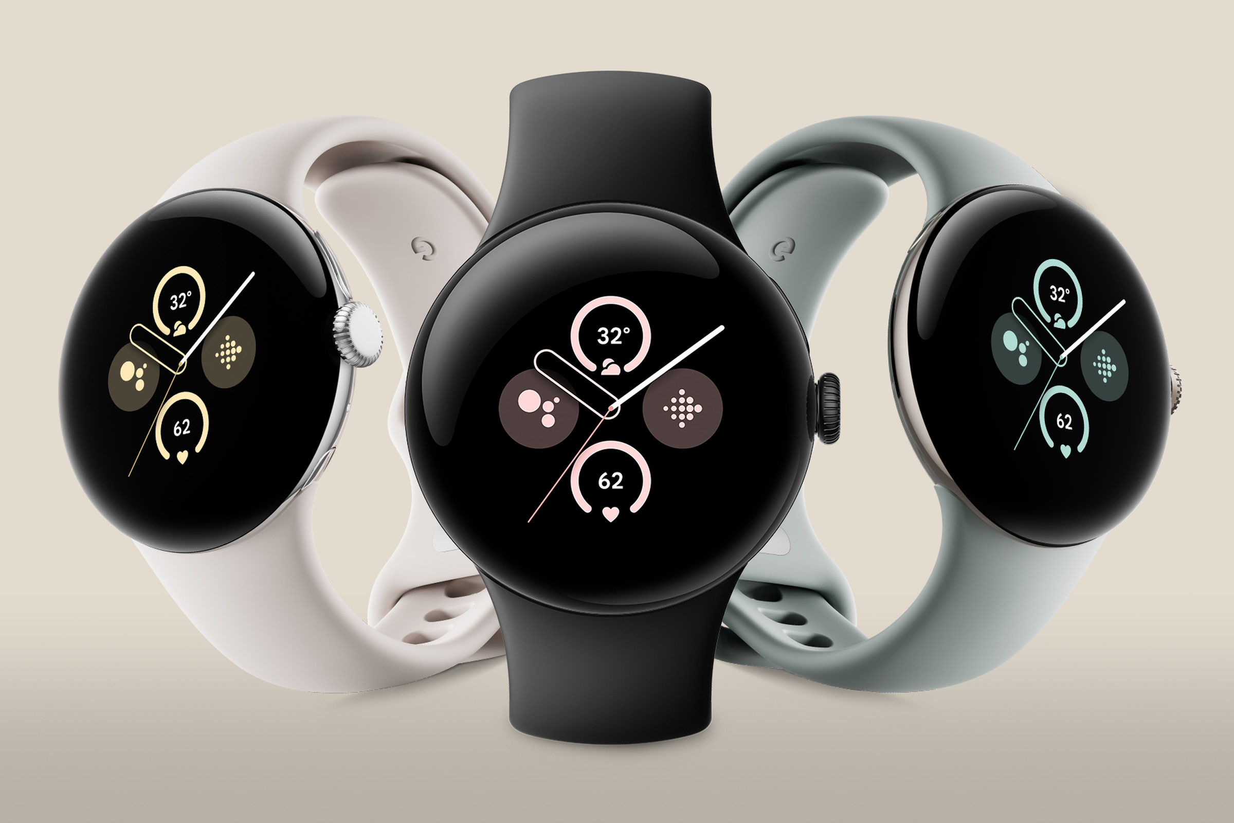 The Google Pixel Watch 2 in its three case colors and finishes (left to right) : polished silver, matte black, and champagne gold.