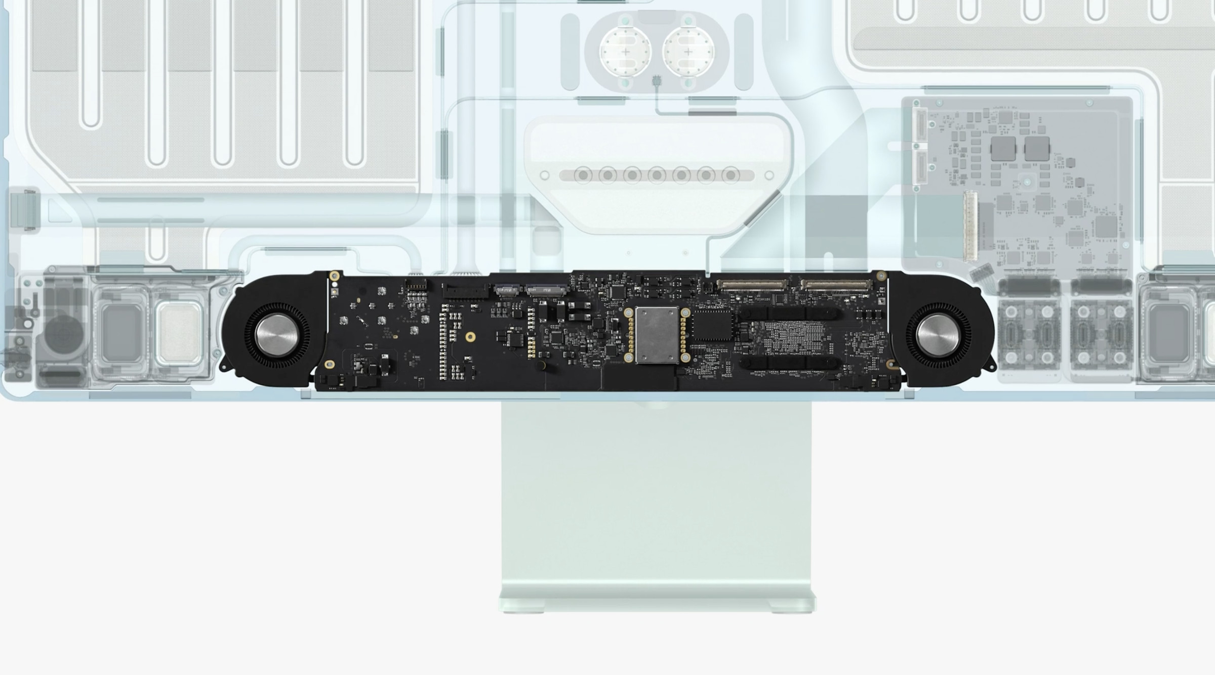 The new iMac’s logic board and cooling system, stuffed into the chin.