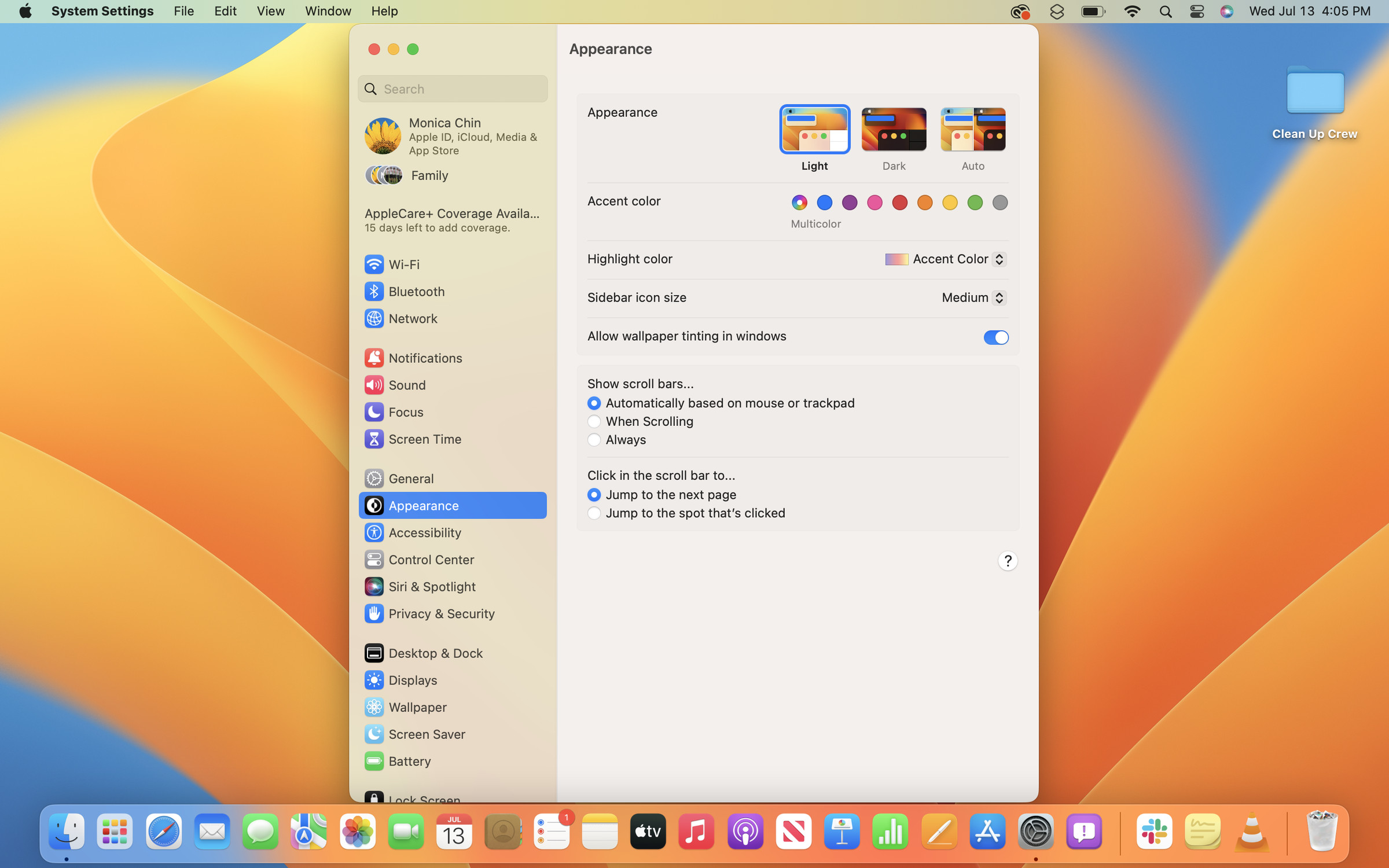 A screenshot of the System Settings app open in macOS Ventura on a blue and orange desktop background.