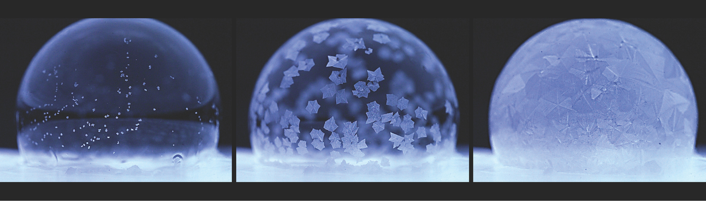 Three images showing three blue soap bubbles in different stages of freezing. To the far left, the bubble has tiny specks. In the middle, the bubble is dotted with larger ice crystals. To the right, the bubble appears frozen solid. 