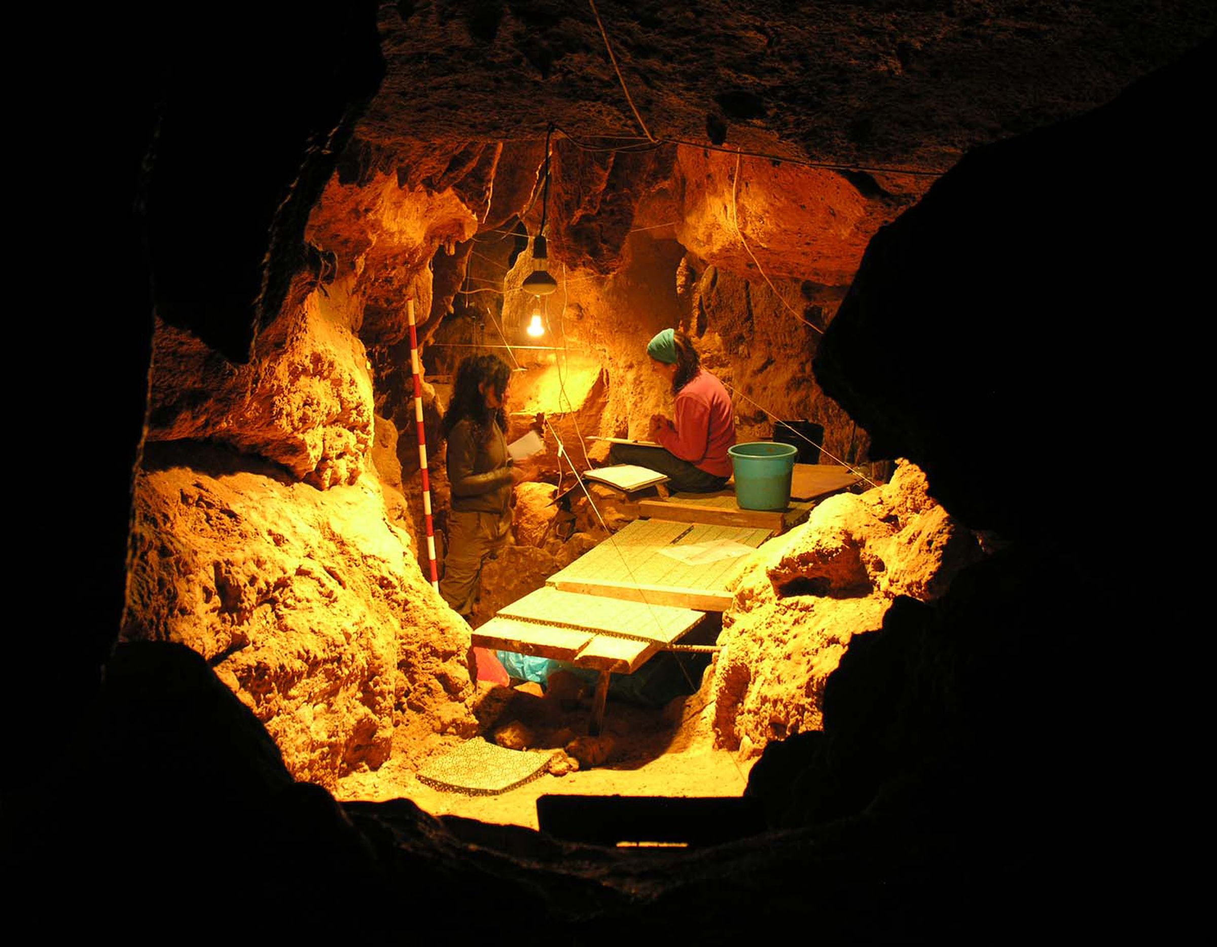 Researchers working inside the El Sidrón cave.