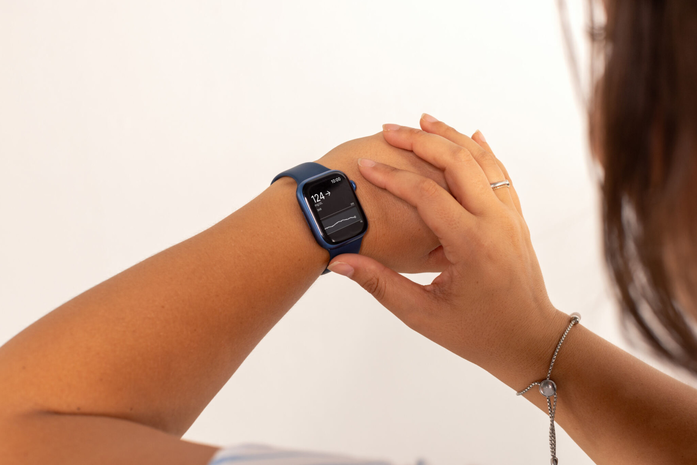 Person looking at blood sugar readings on Apple Watch