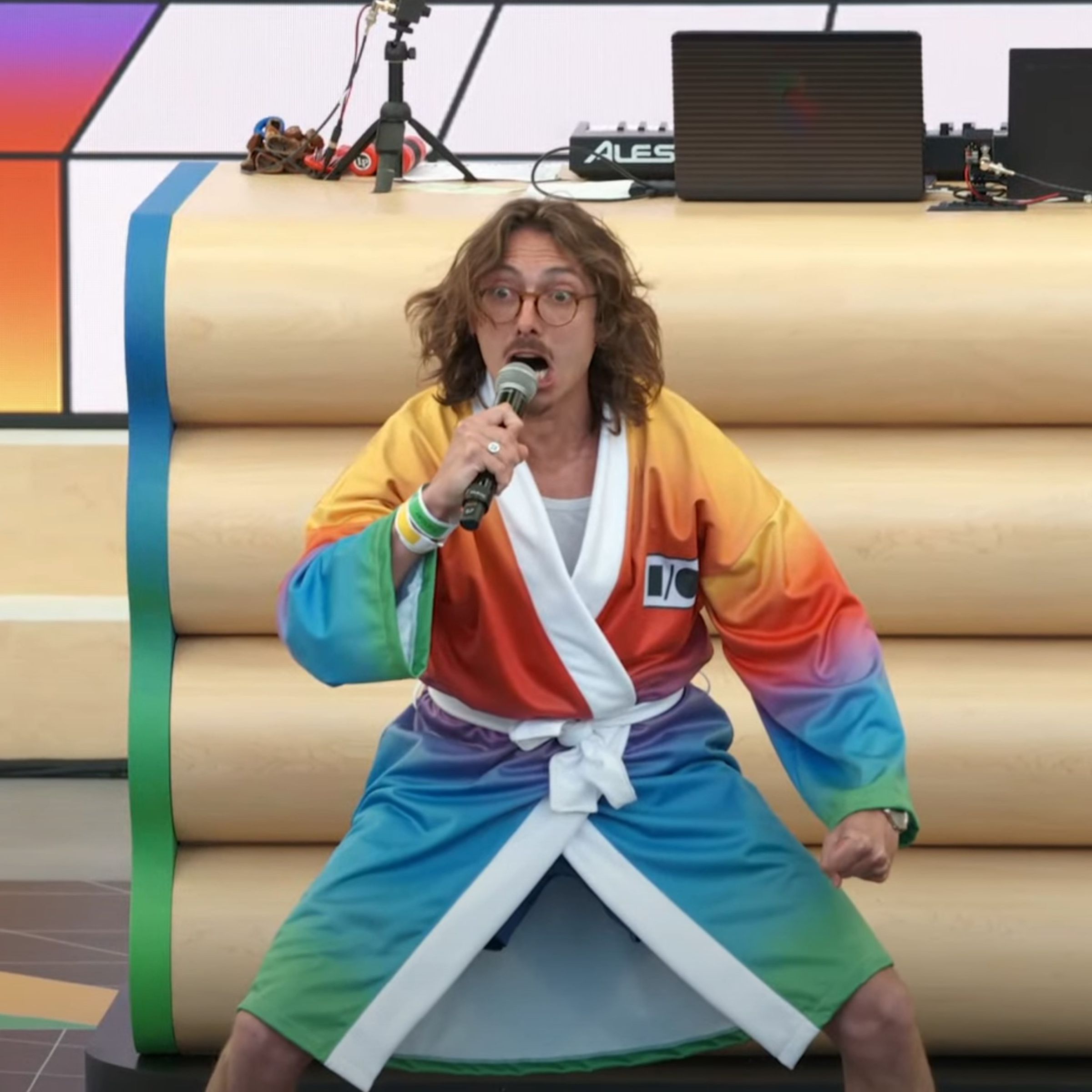 Marc Rebillet kicking off Google’s I/O event in a rainbow-colored bath robe