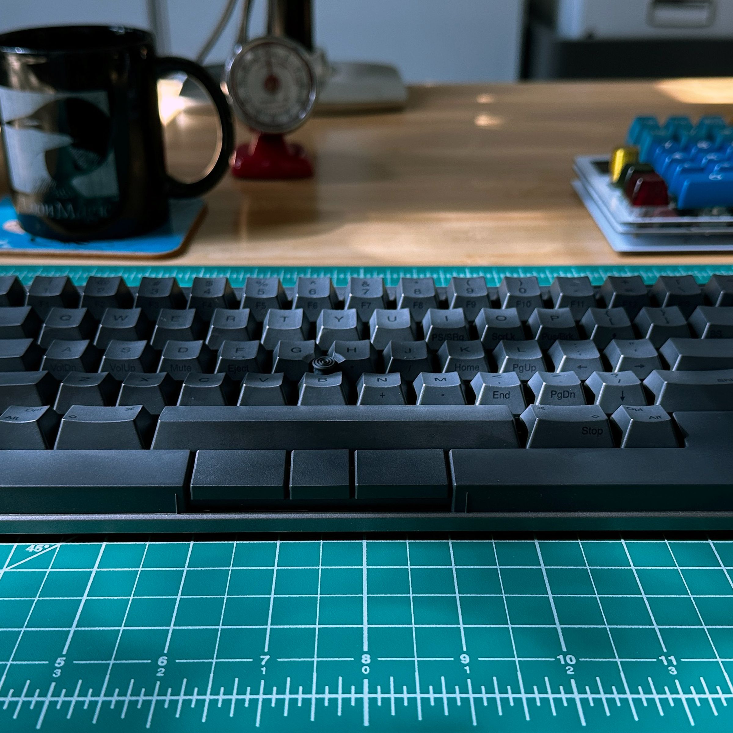 Photo of the HHKB Studio on a green grid background.