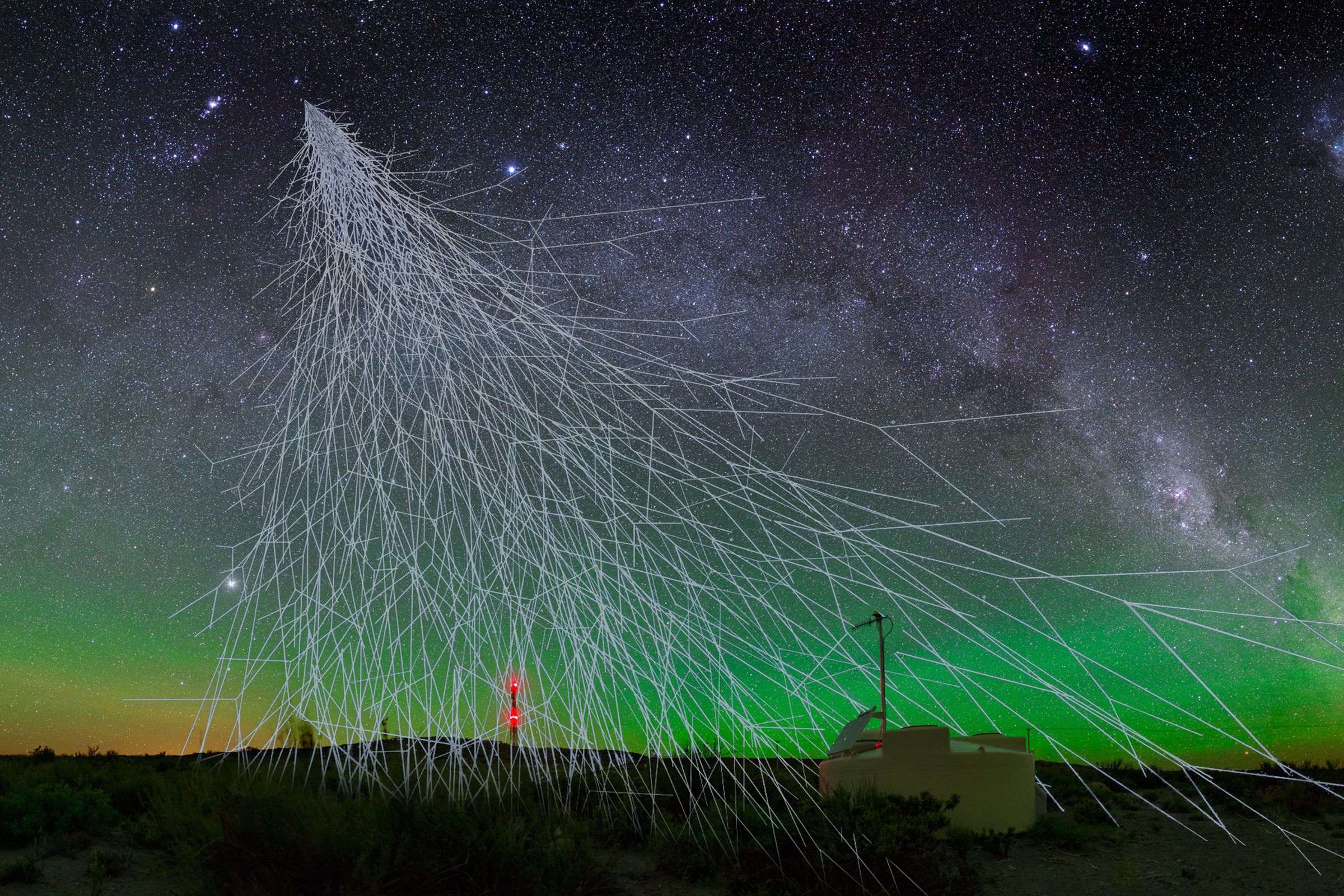A rendering of cosmic rays showering particles onto Earth.