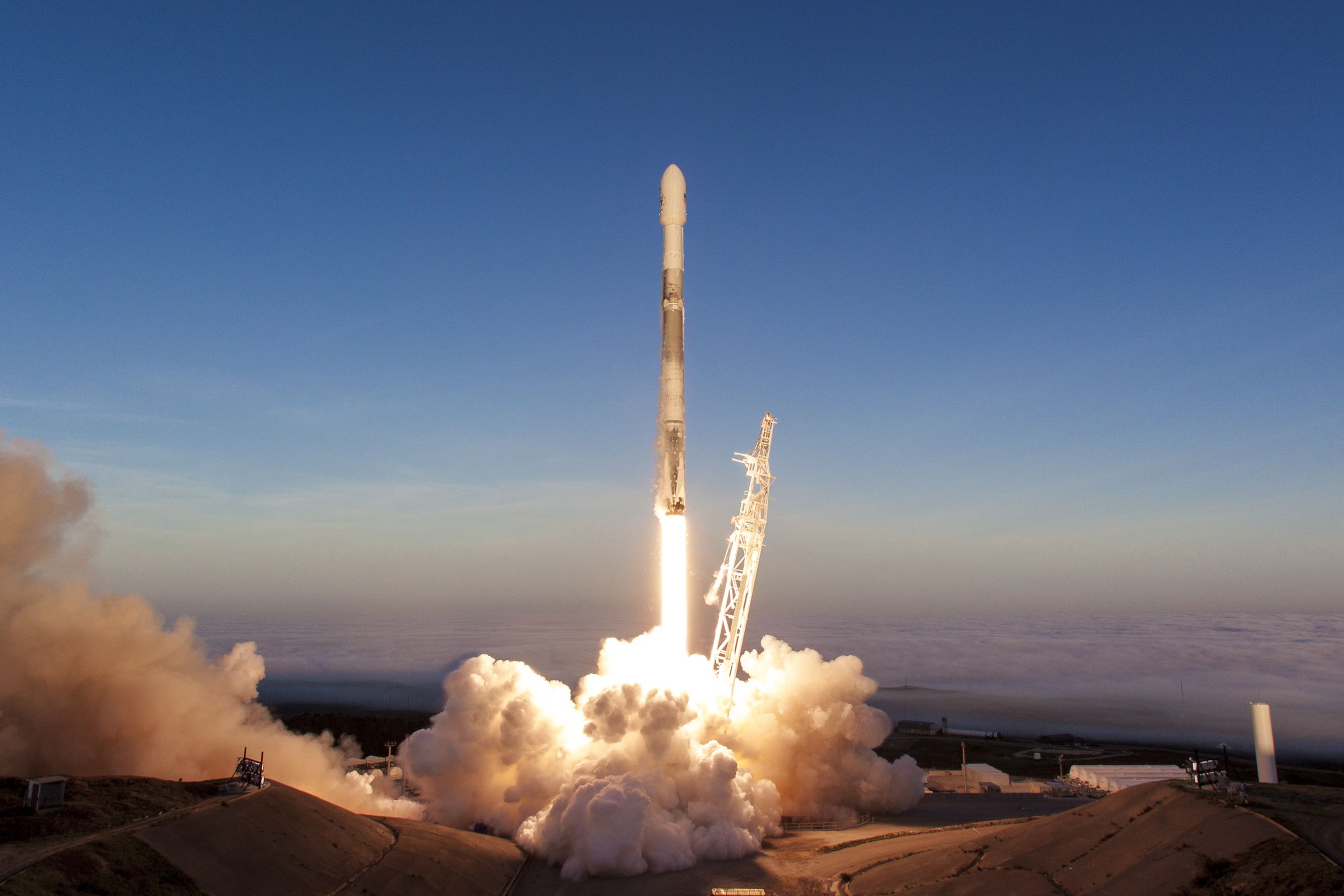 A SpaceX Falcon 9 rocket taking off from Vandenberg Air Force Base