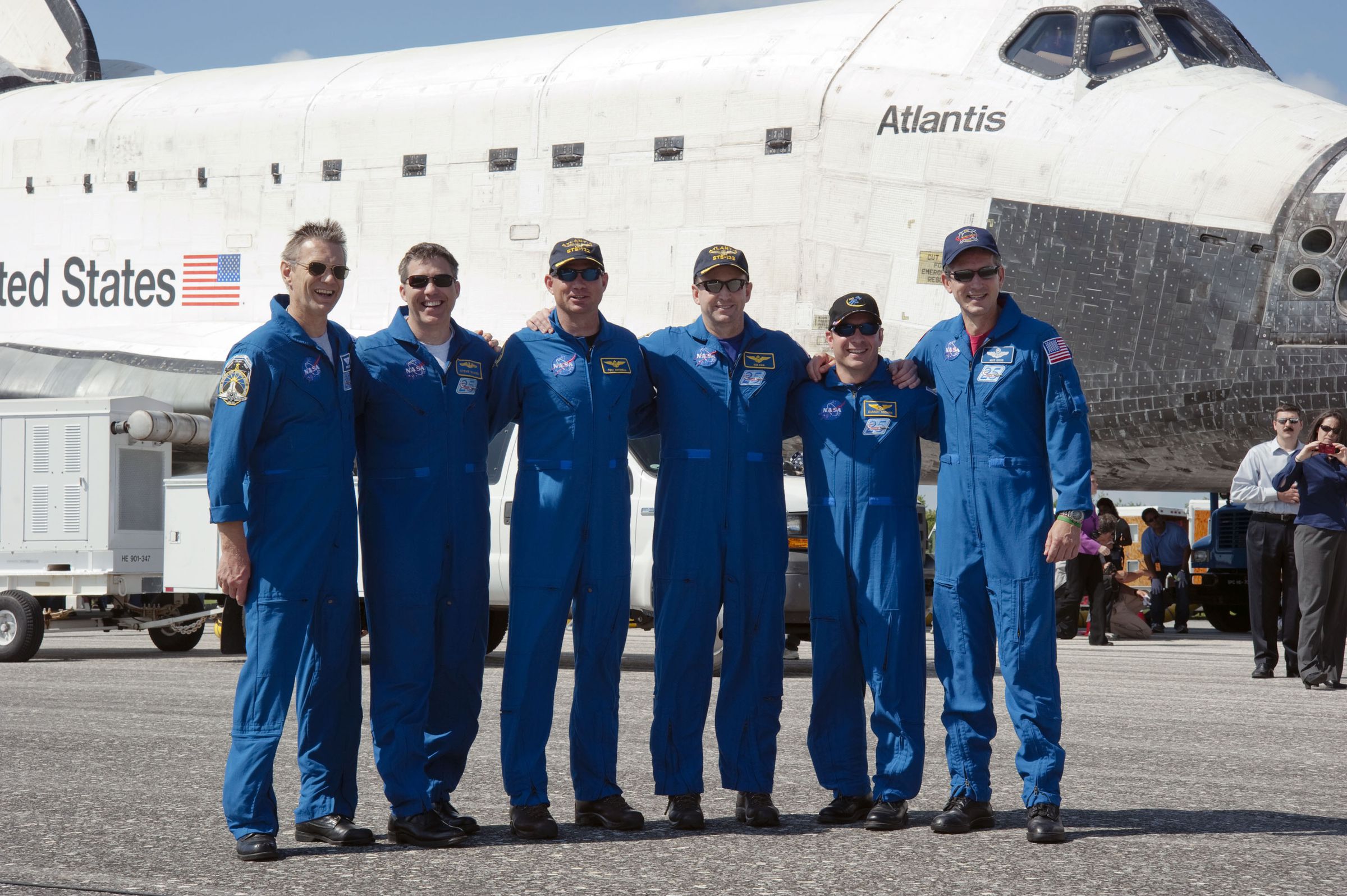 Garrett Reisman (second from right) stands with his crew in Cape Canaveral, after landing STS-132