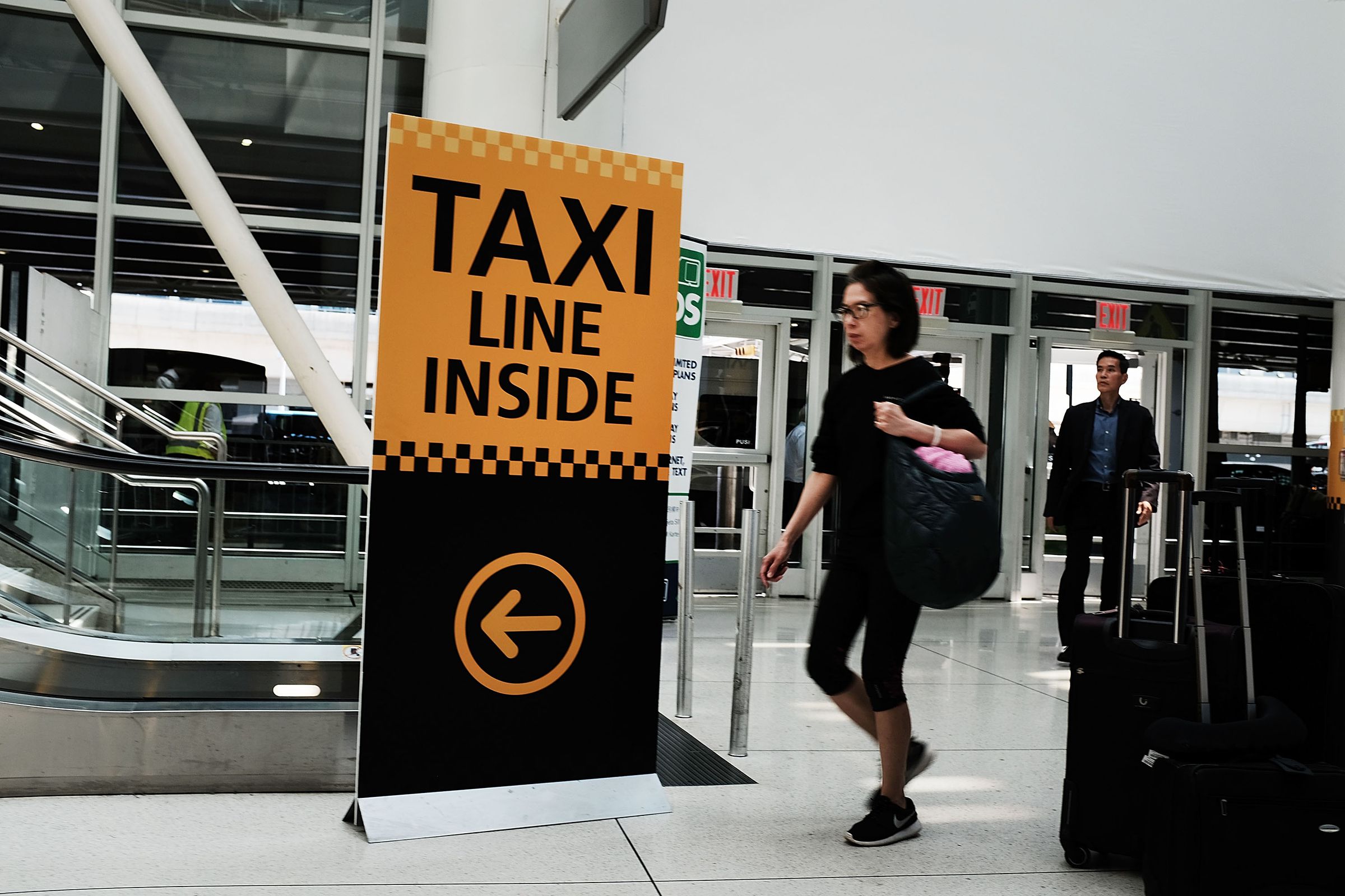 NEW YORK, NY - JUNE 19: A sign advertises directions to a taxi stand at John F. Kennedy (JFK) Airport on June 19, 2018 in New York City.
