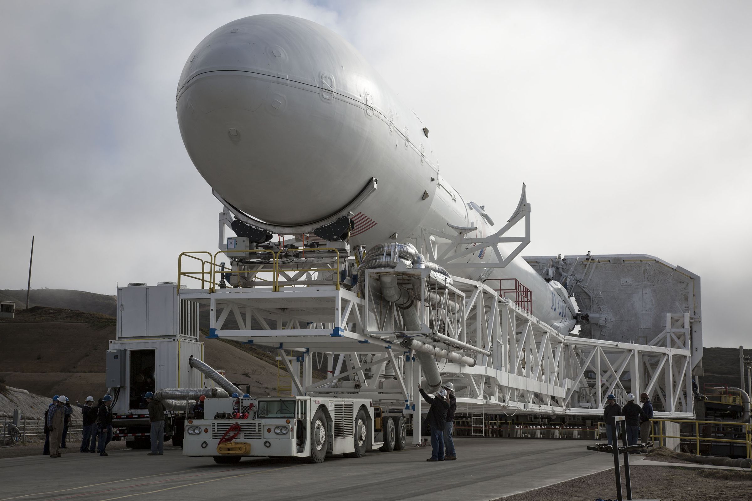 One of SpaceX’s Falcon 9 rockets rolls out to the launch pad at Vandenberg Air Force Base.