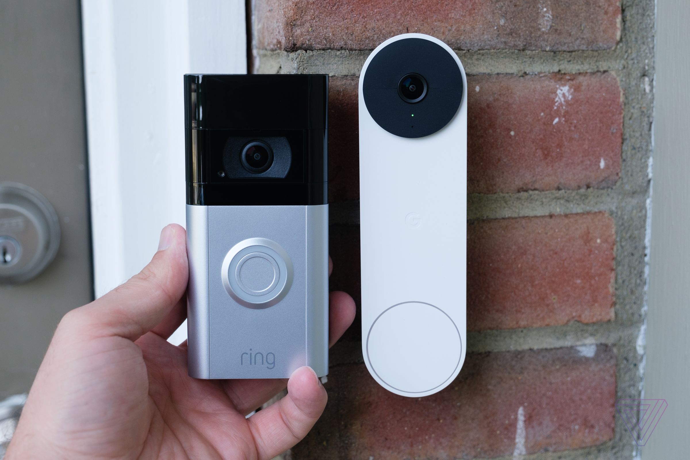 The Nest Doorbell next to the Ring Video Doorbell.