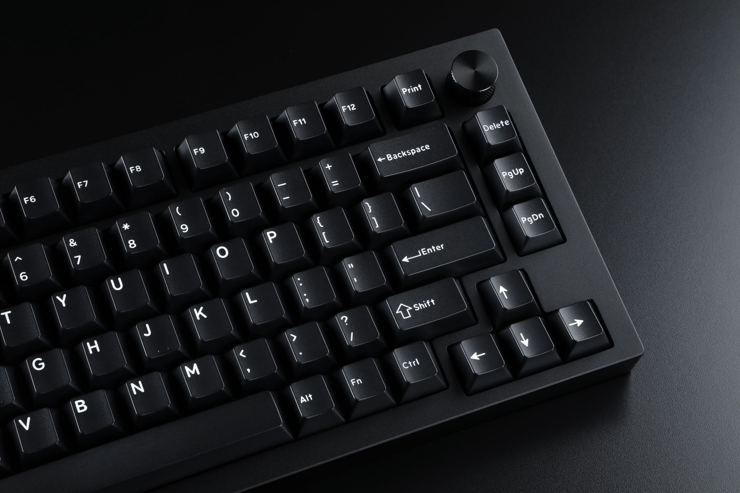 The right-hand side of the Sense75 keyboard from Drop, in all black with white-on-black DCX keycaps.