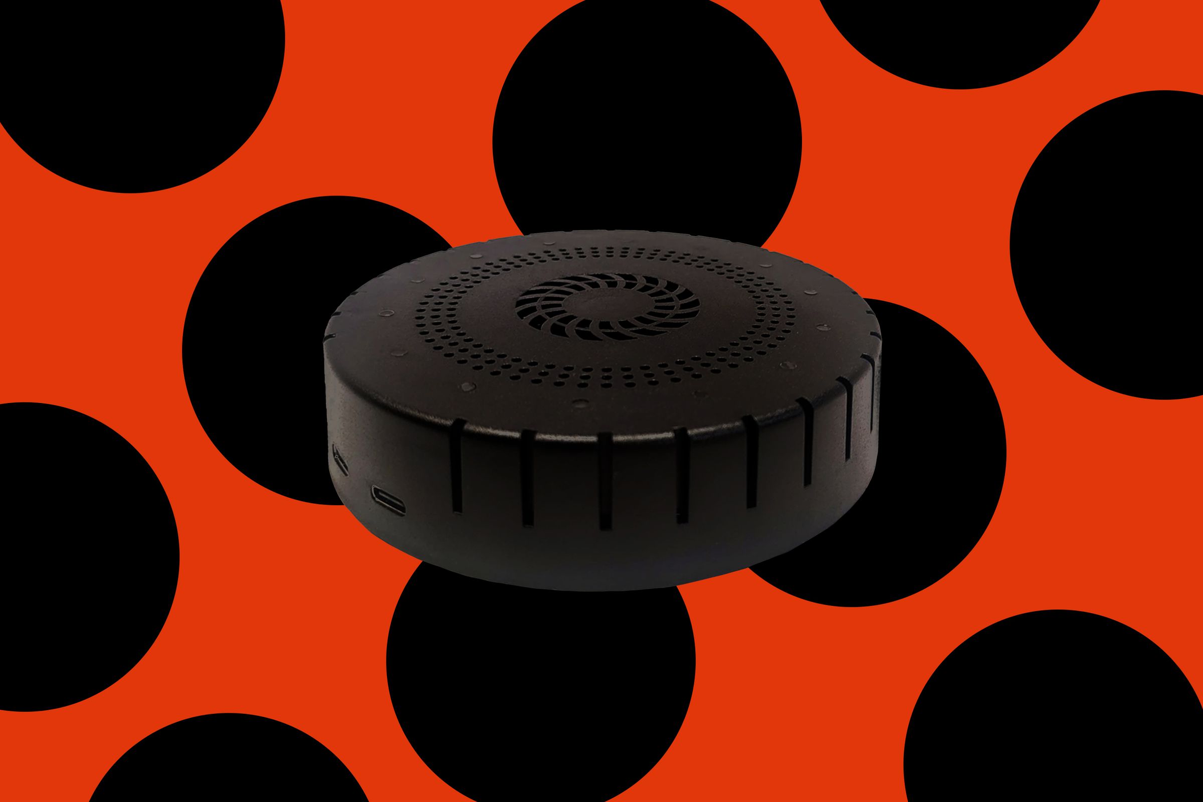The WiFi Coconut is a router over a red background with black dots.