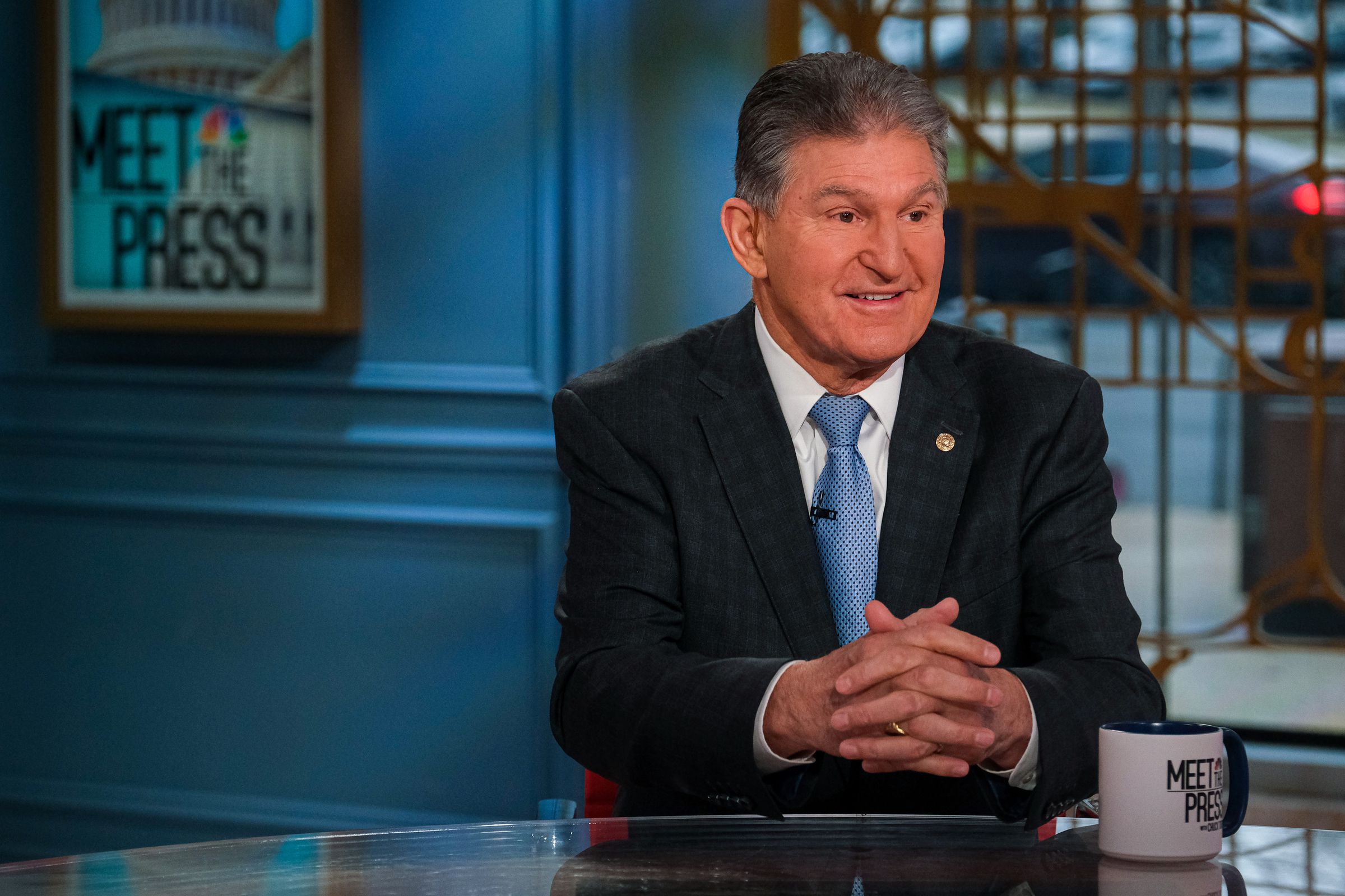 Joe Manchin is trying to derail the EV tax credit he helped craft